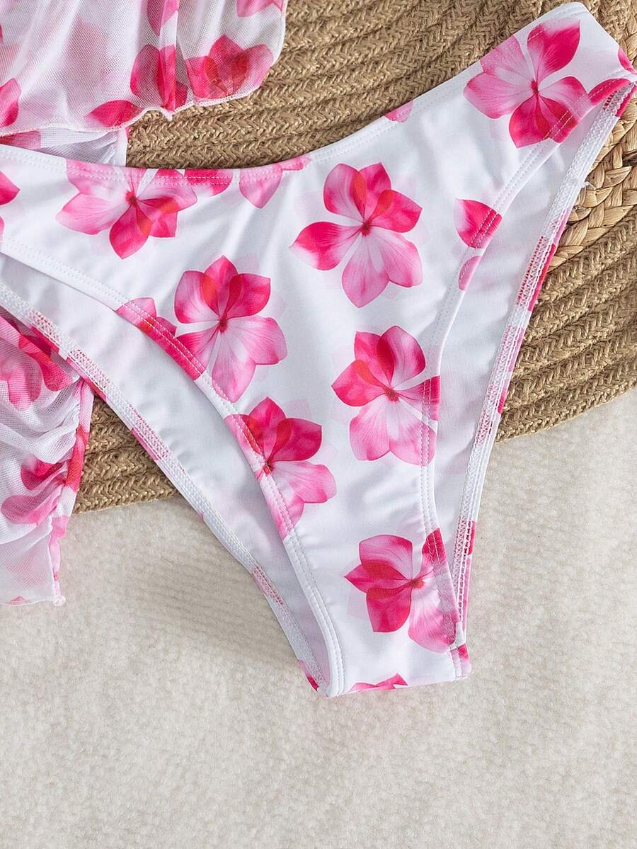 Women's 3-piece floral bikini set featuring a multicolor plant print halter top with 3D rose detail, matching bikini bottoms, and short skirt cover-up