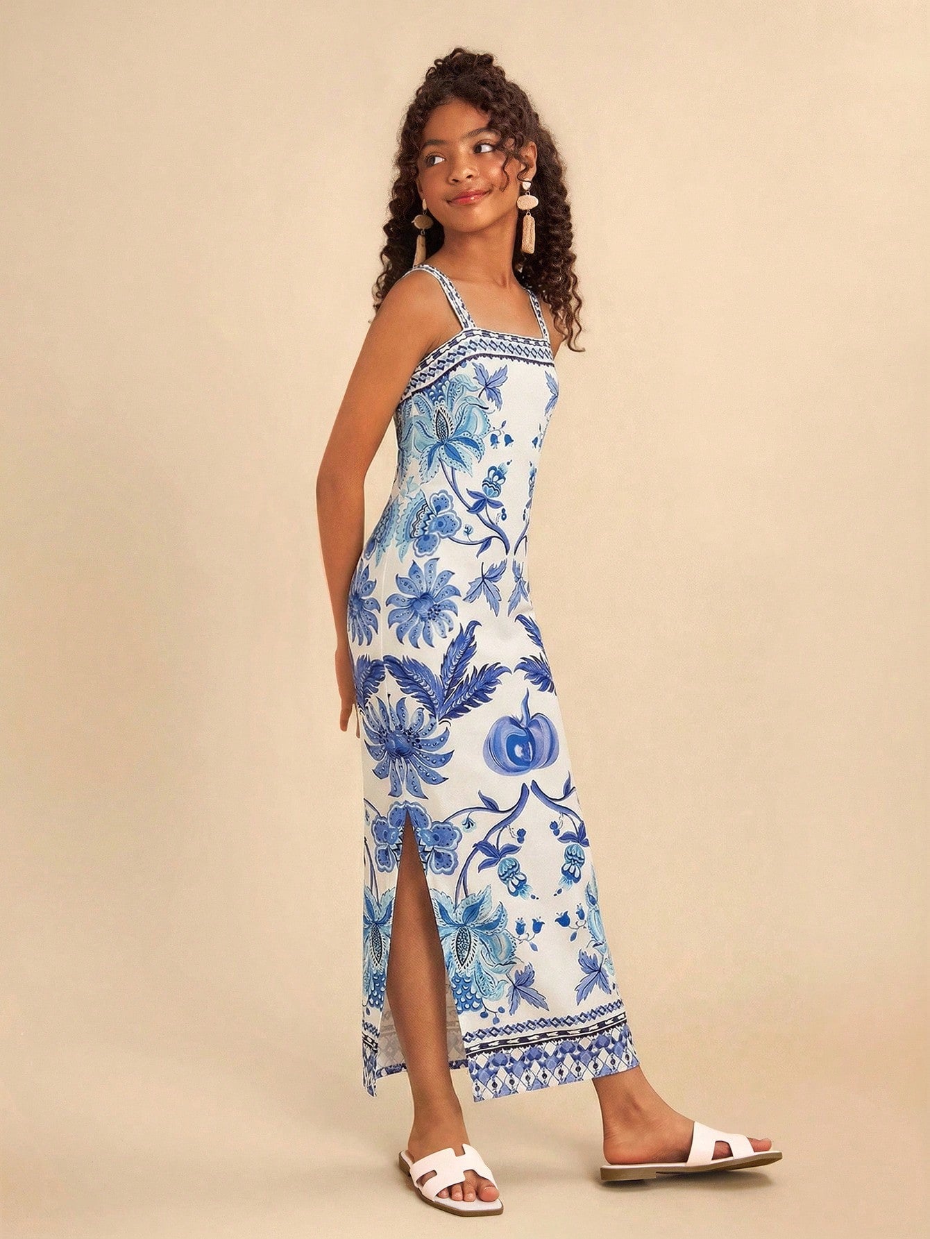 Tween girls' multicolor fruit print cami dress with spaghetti straps, sleeveless slim fit, split detail, natural waist, and long straight hem for vacation wear.