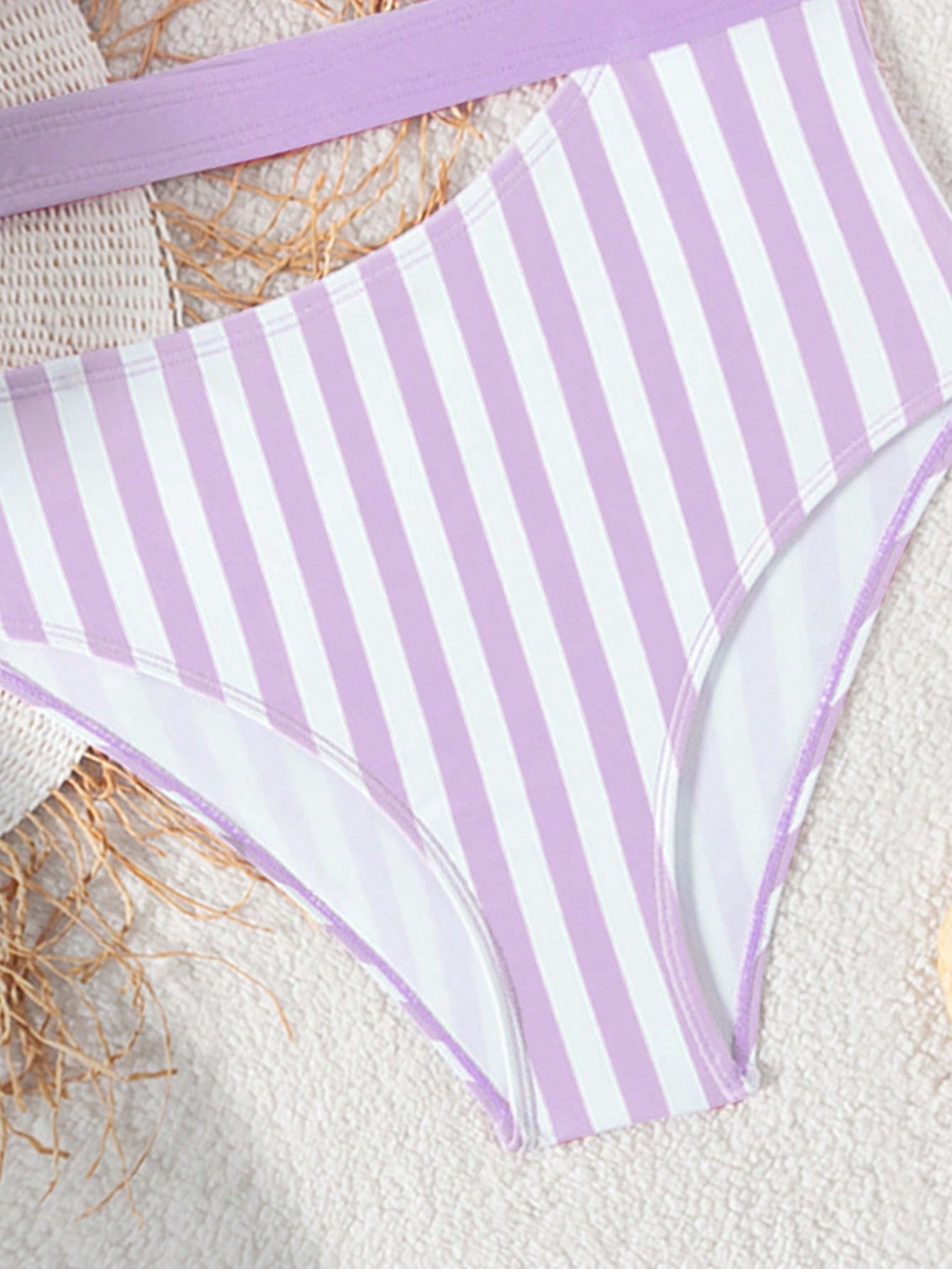Purple tween girls one-piece swimsuit with asymmetrical neckline, cut-out waist, striped pattern, fitted silhouette, and lined body.