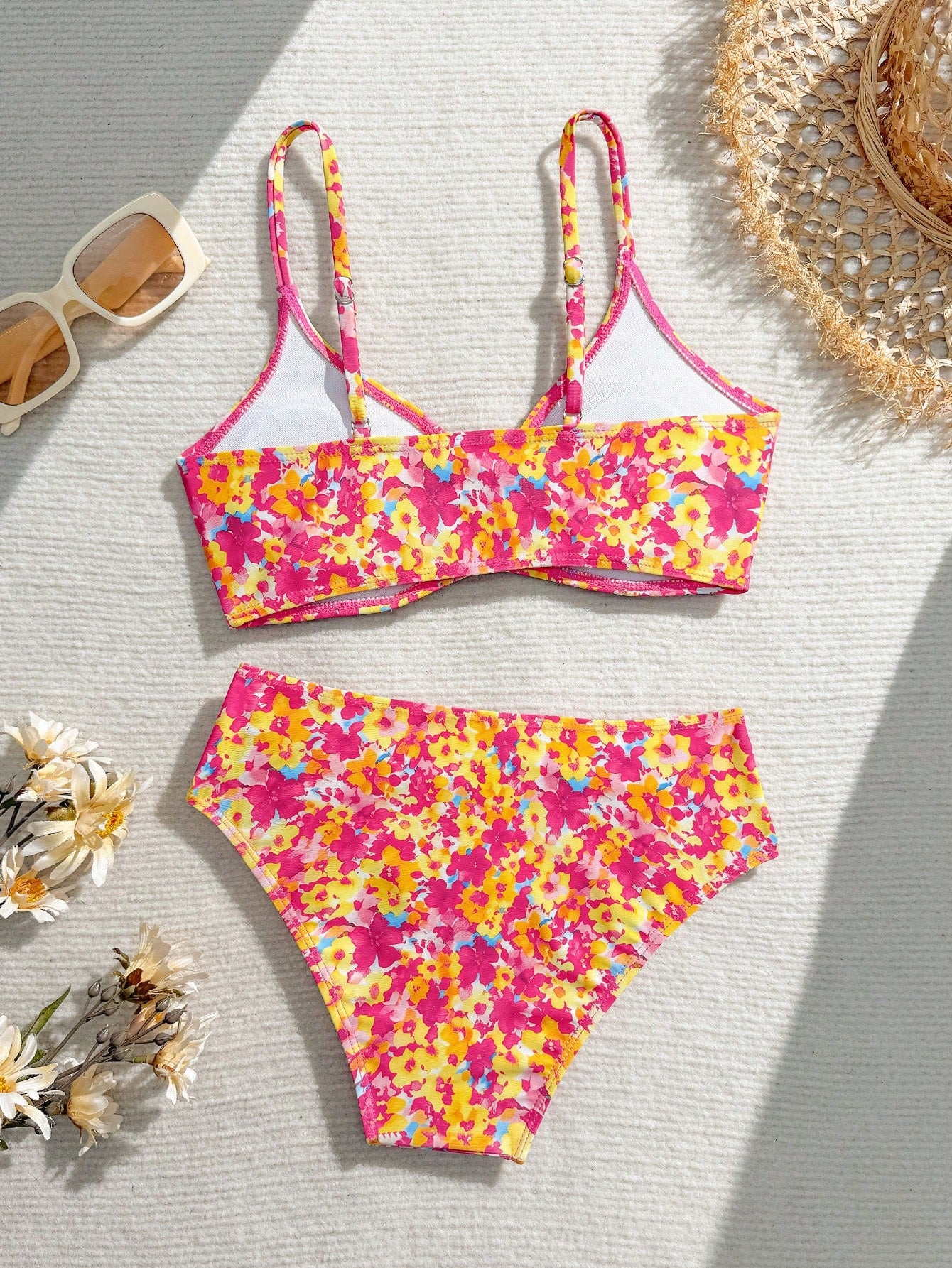 Tween girls 2-piece ditsy floral bikini set featuring a spaghetti strap top with center string detail and matching bottoms with side strings, designed for swimming, vacation, and summer wear.