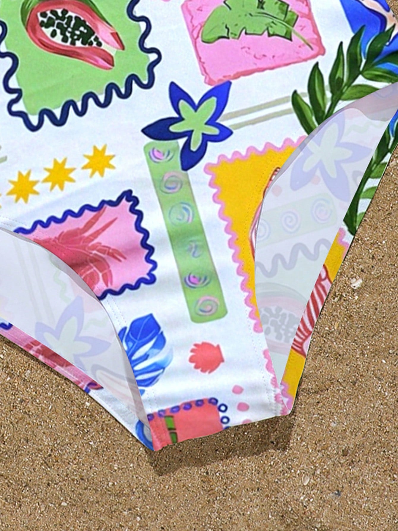 Tween girls one-piece swimsuit with multicolor ocean shell and seahorse all-over print, spaghetti straps, cut-out detail, and lined body for beach or swimming.