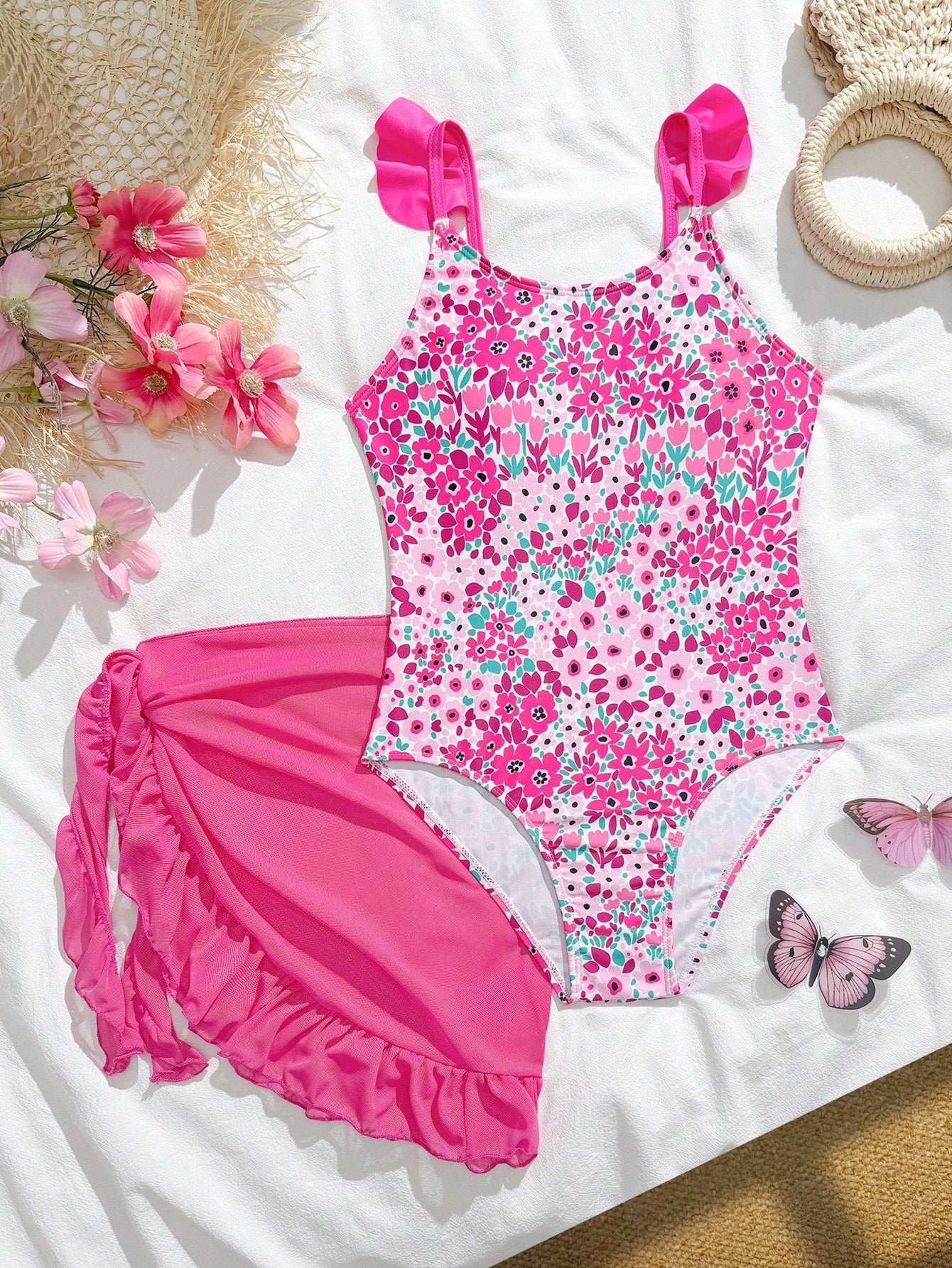 Tween girls one-piece swimsuit in leopard print with ruffle shoulder straps, scoop neckline, fitted shape, and attached ruffle hem skirt; sleeveless, mid-waist skirt bottom, and lined body for swimming, vacation, and summer beach wear.