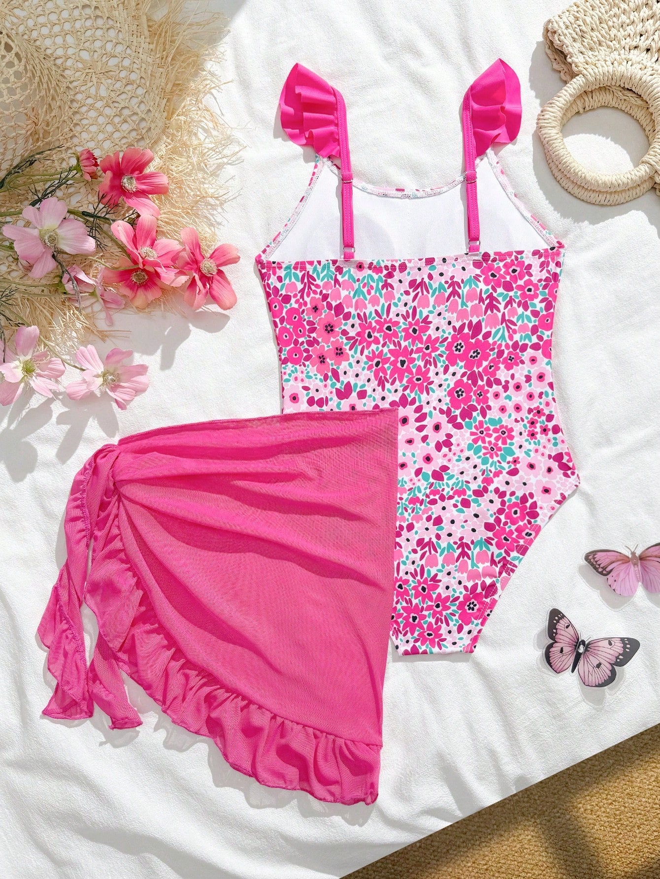 Tween girls one-piece swimsuit in leopard print with ruffle shoulder straps, scoop neckline, fitted shape, and attached ruffle hem skirt; sleeveless, mid-waist skirt bottom, and lined body for swimming, vacation, and summer beach wear.