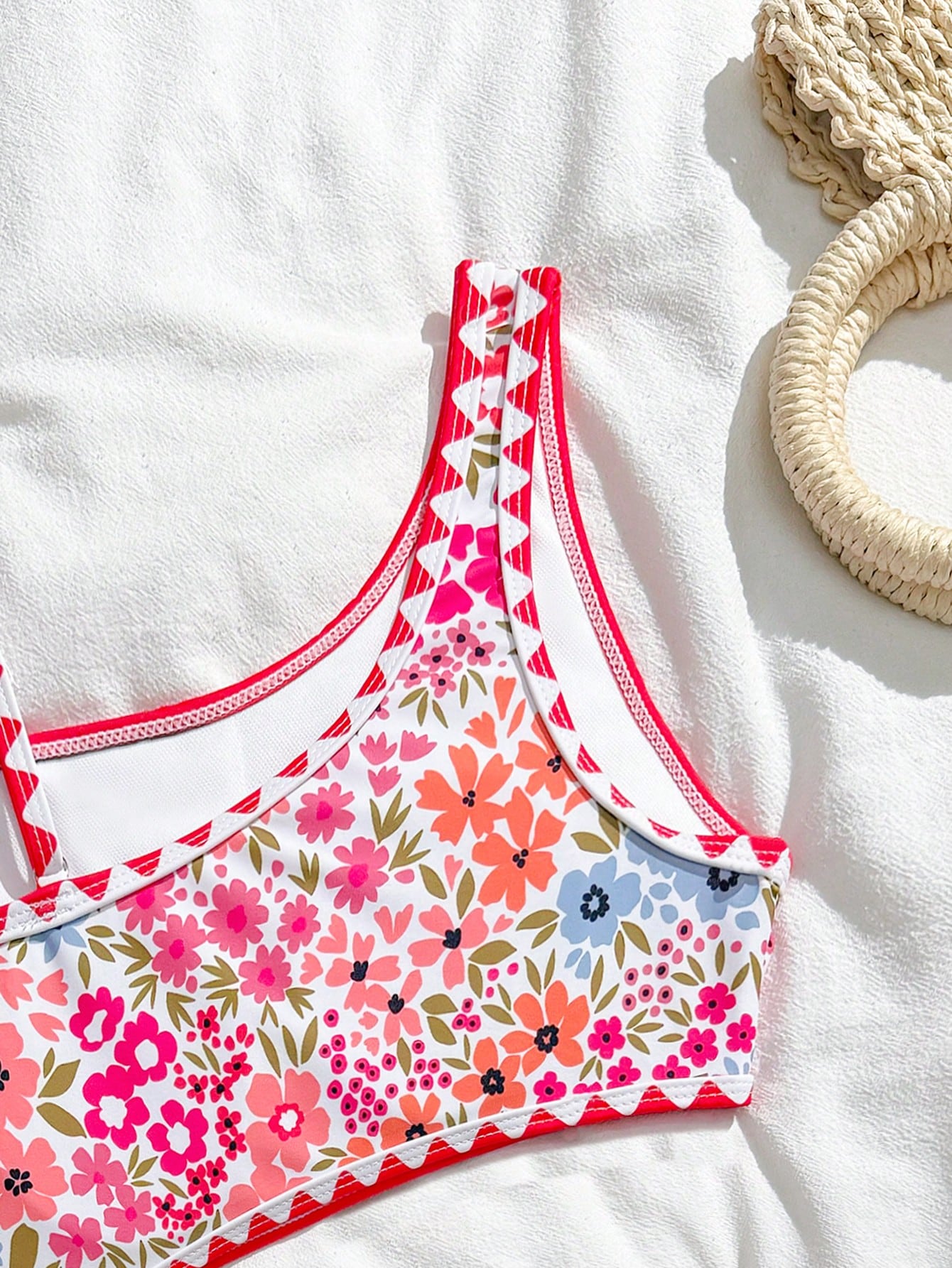 Tween girls one-piece swimsuit featuring an asymmetric neckline, pendant decor, plain design, wireless bra, high-cut bottom, and medium-stretch fabric.