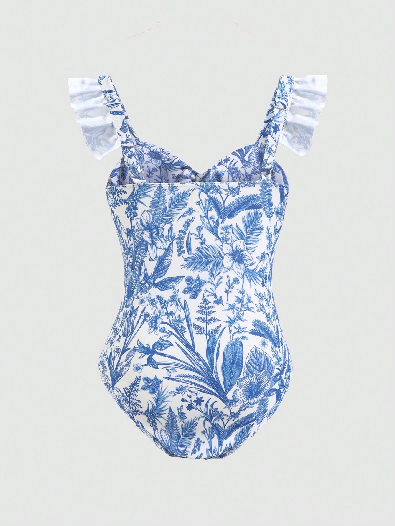 Tween girls blue and white floral print one-piece swimsuit with ruffle detail, spaghetti straps, V-neck styling, and vacation beachwear look.