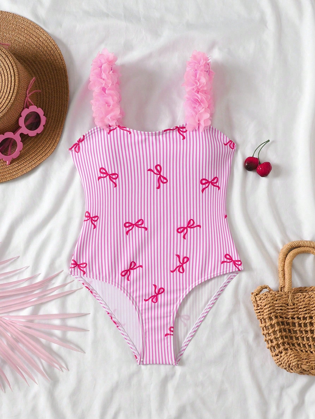 NEWSHEIN tween girls one-piece swimsuit in blue with geometric full print, twist shoulder straps, lined body, and vacation swimwear style.
