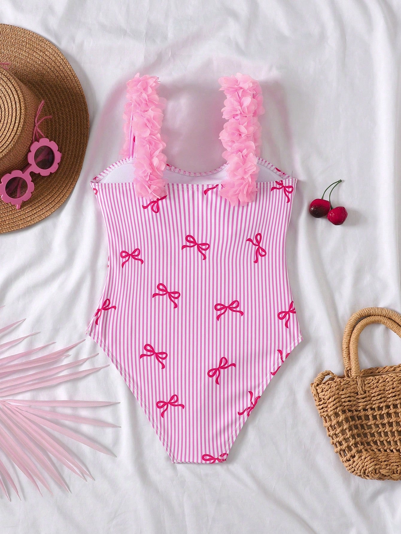 NEWSHEIN tween girls one-piece swimsuit in blue with geometric full print, twist shoulder straps, lined body, and vacation swimwear style.