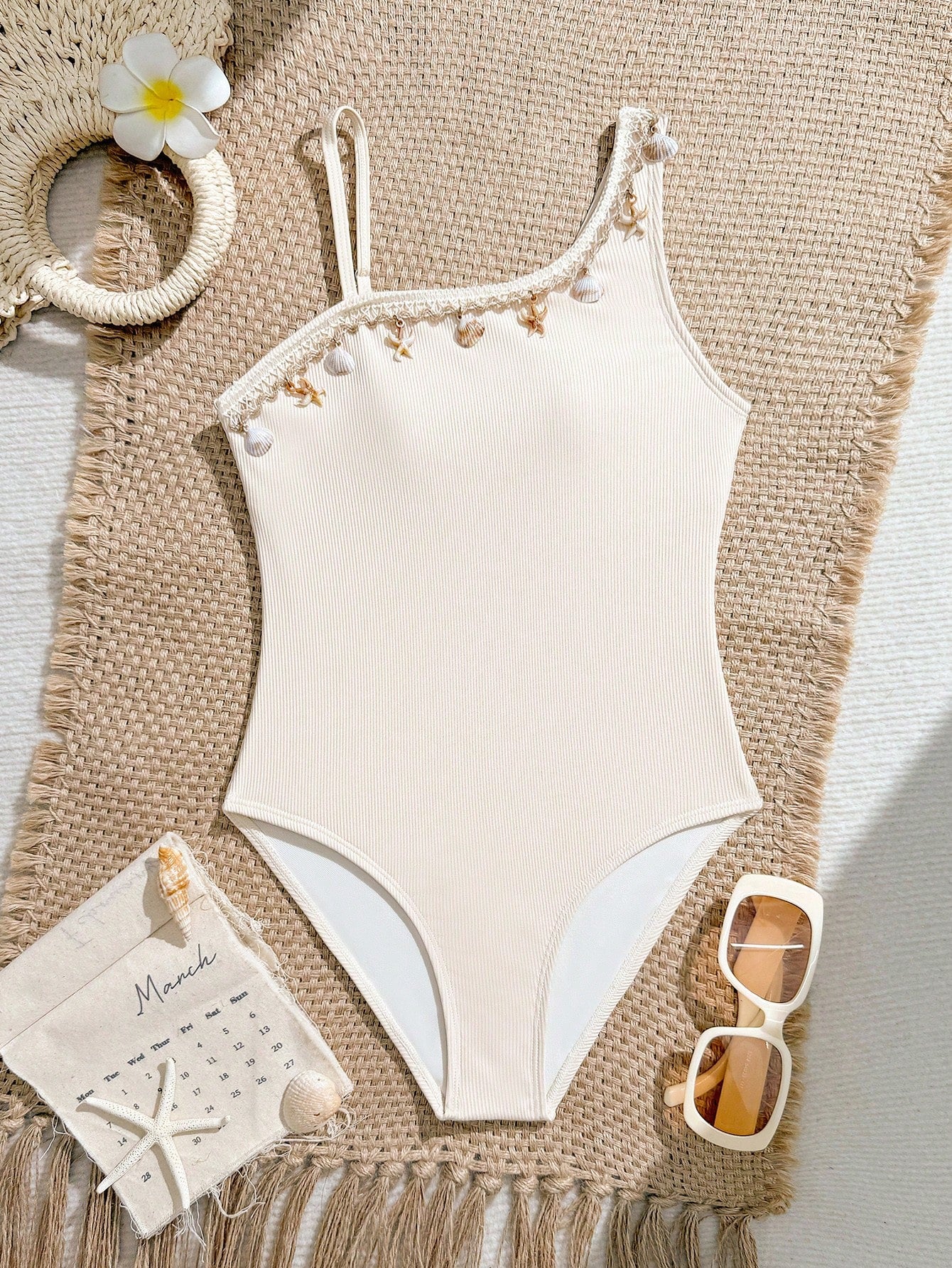 Tween girls one-piece swimsuit featuring an asymmetric neckline, pendant decor, plain design, wireless bra, high-cut bottom, and medium-stretch fabric.