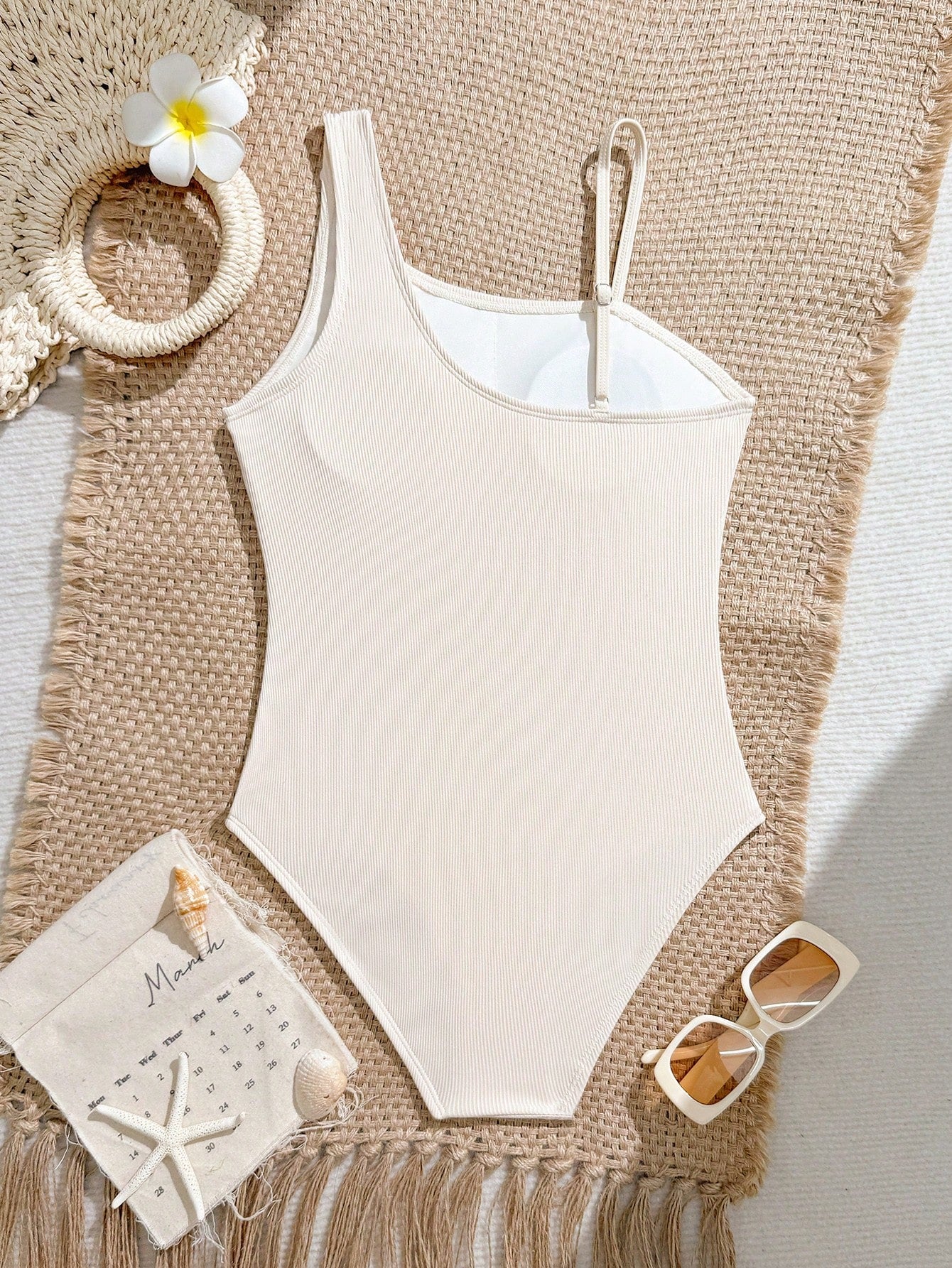 Tween girls one-piece swimsuit featuring an asymmetric neckline, pendant decor, plain design, wireless bra, high-cut bottom, and medium-stretch fabric.