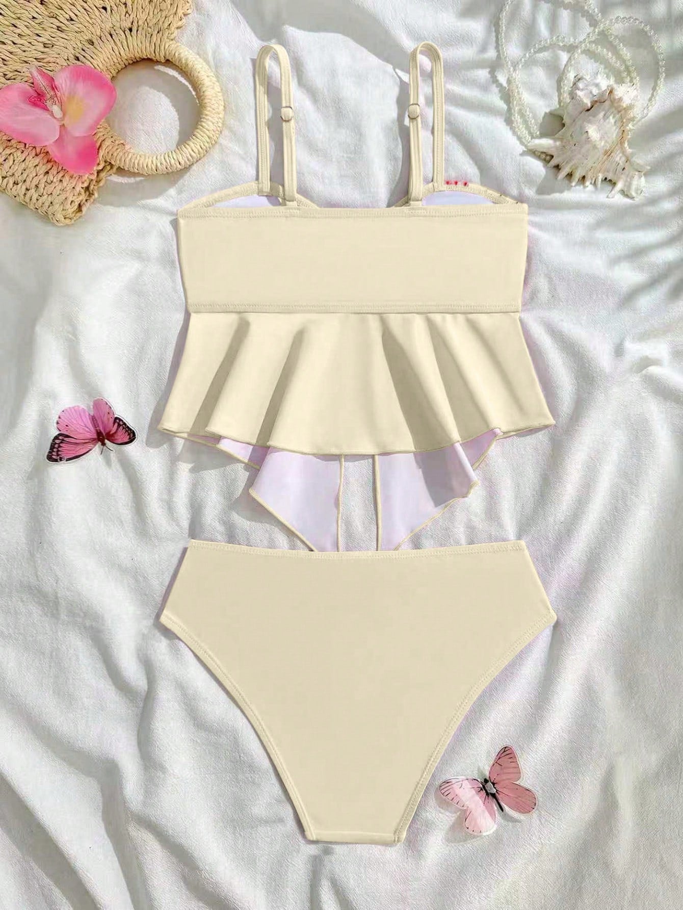 Tween girls 2-piece tankini swimwear set in apricot with a textured jacquard look, asymmetrical spaghetti-strap sleeveless top, and matching mid-waist short bikini bottoms.