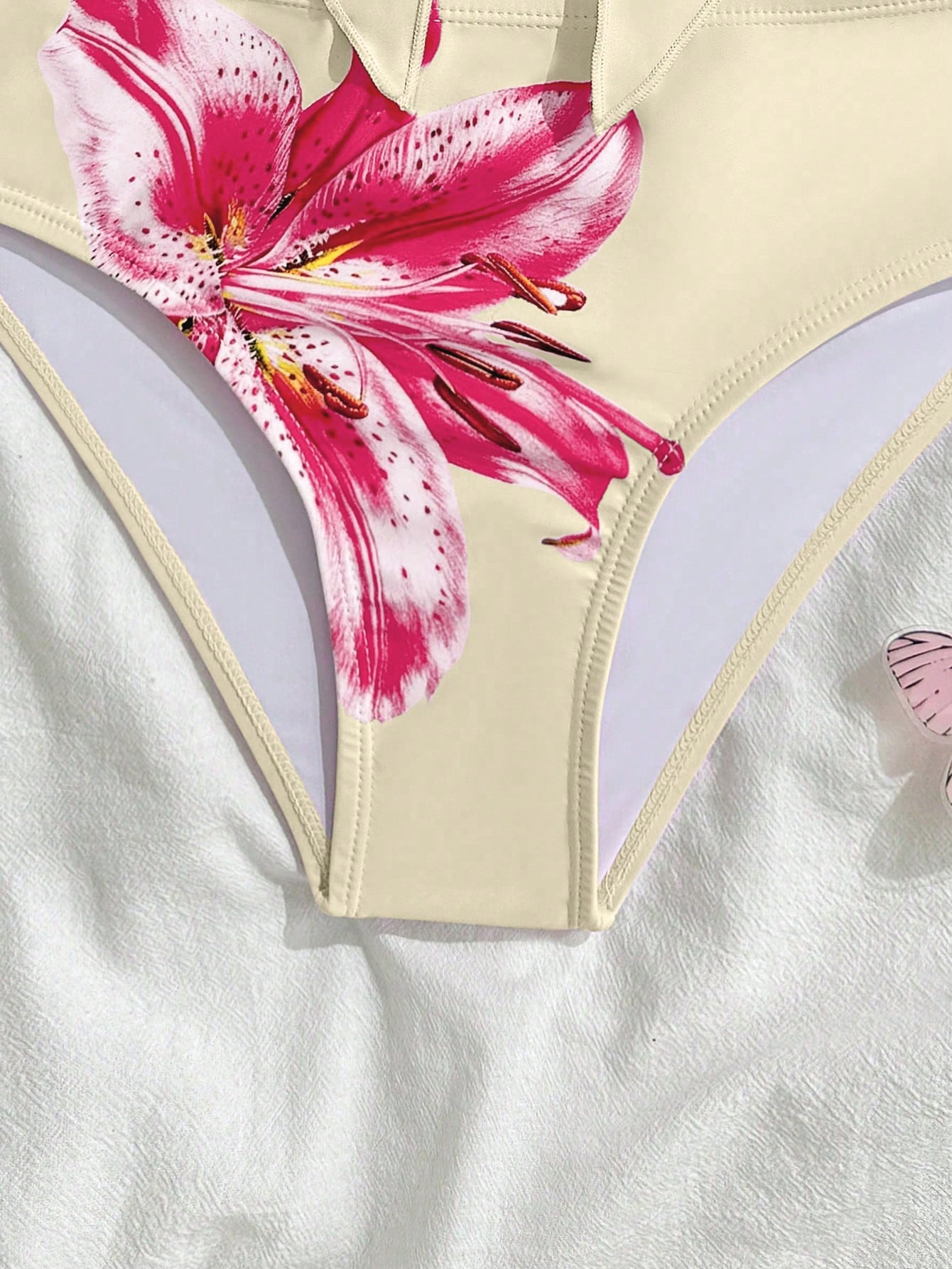 Tween girls two-piece tankini swimwear set with spaghetti straps, asymmetrical design, and 3D rose detail. Features a plant-pattern top and mid-waist bottoms in stretchy fabric for beach or pool wear.
