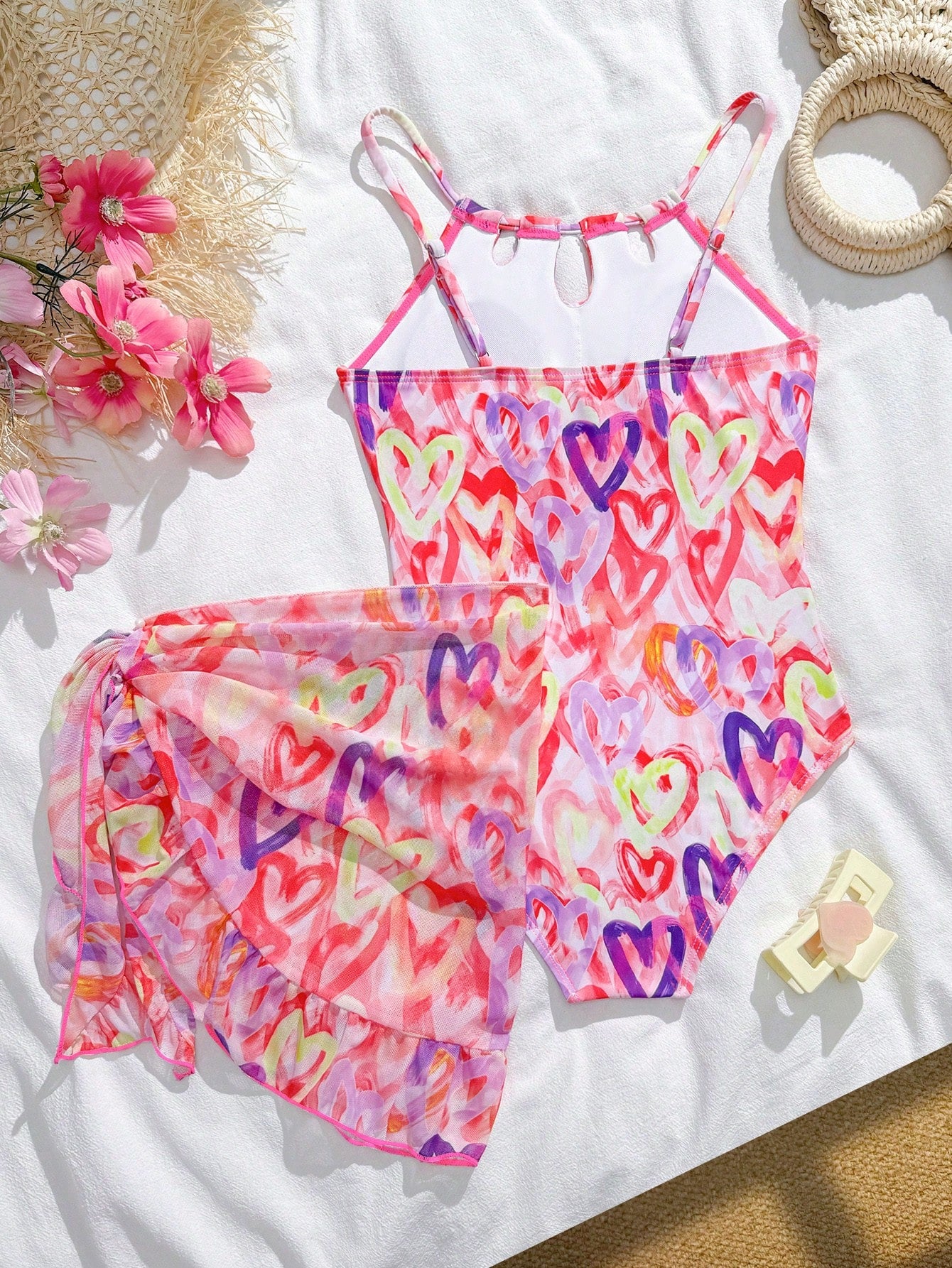 Girls black and white one-piece swimsuit set with cut-out detail, spaghetti straps, sleeveless fitted design, and matching skirt bottom for vacation swimwear.