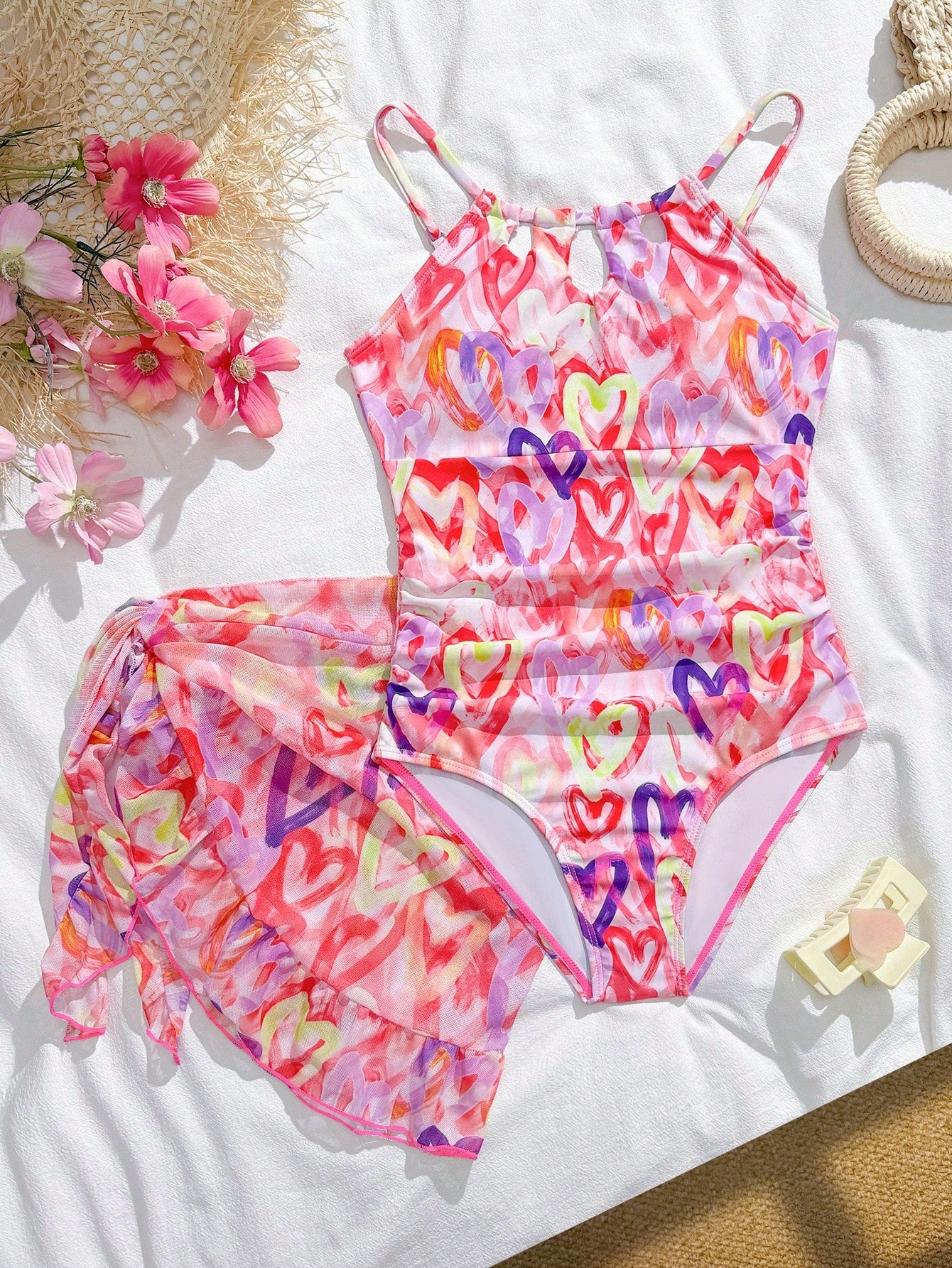 Girls black and white one-piece swimsuit set with cut-out detail, spaghetti straps, sleeveless fitted design, and matching skirt bottom for vacation swimwear.