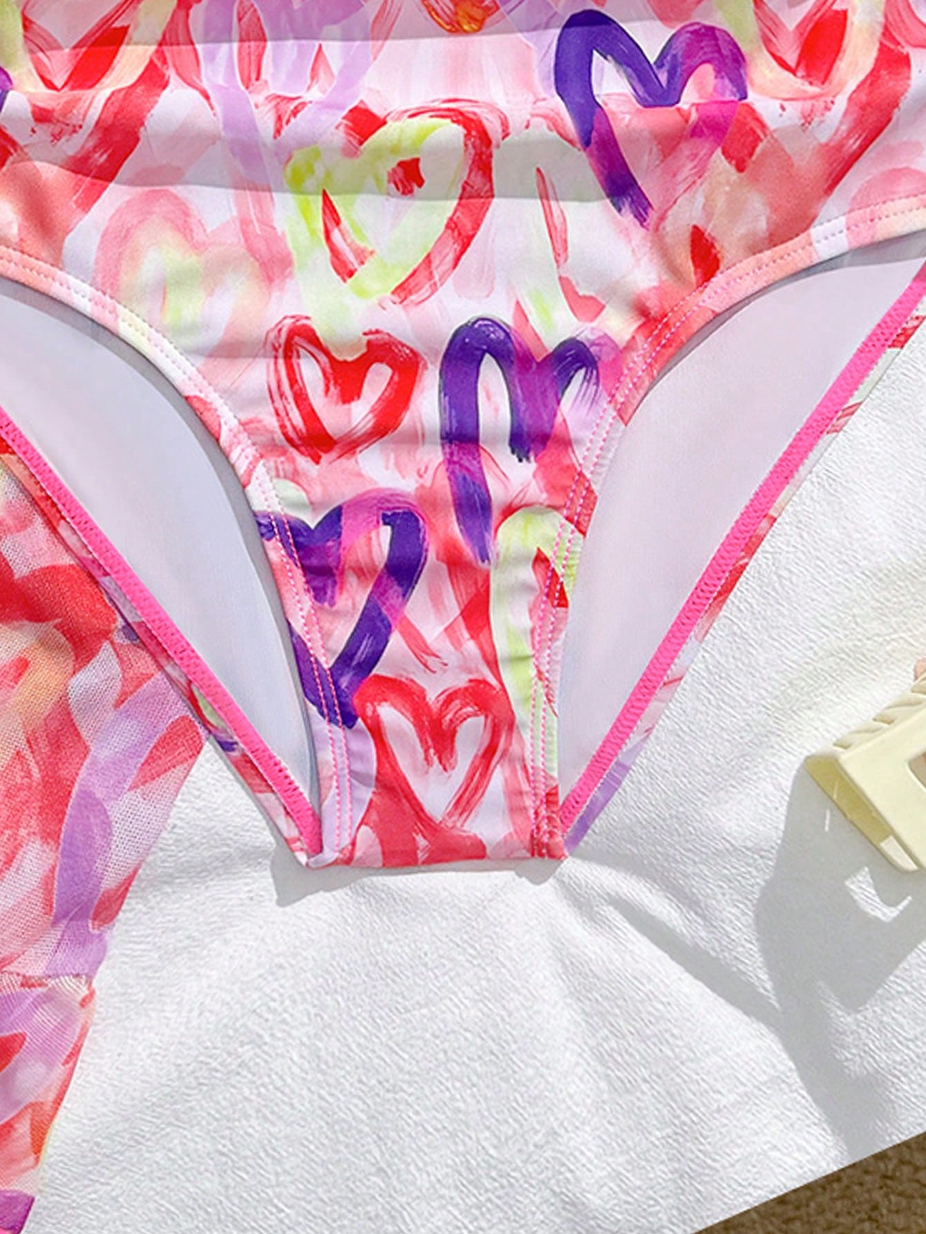 Girls black and white one-piece swimsuit set with cut-out detail, spaghetti straps, sleeveless fitted design, and matching skirt bottom for vacation swimwear.