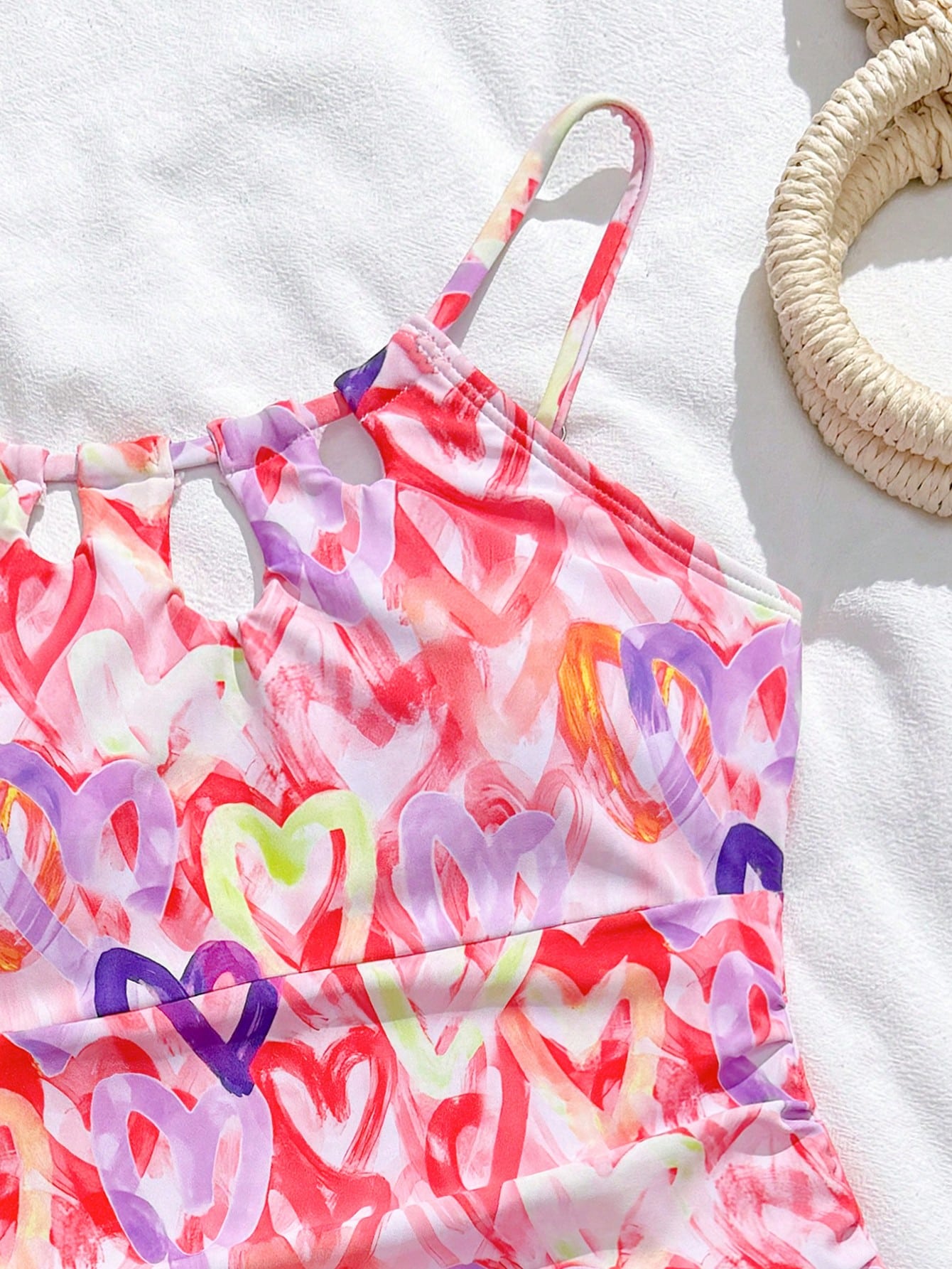 Girls black and white one-piece swimsuit set with cut-out detail, spaghetti straps, sleeveless fitted design, and matching skirt bottom for vacation swimwear.