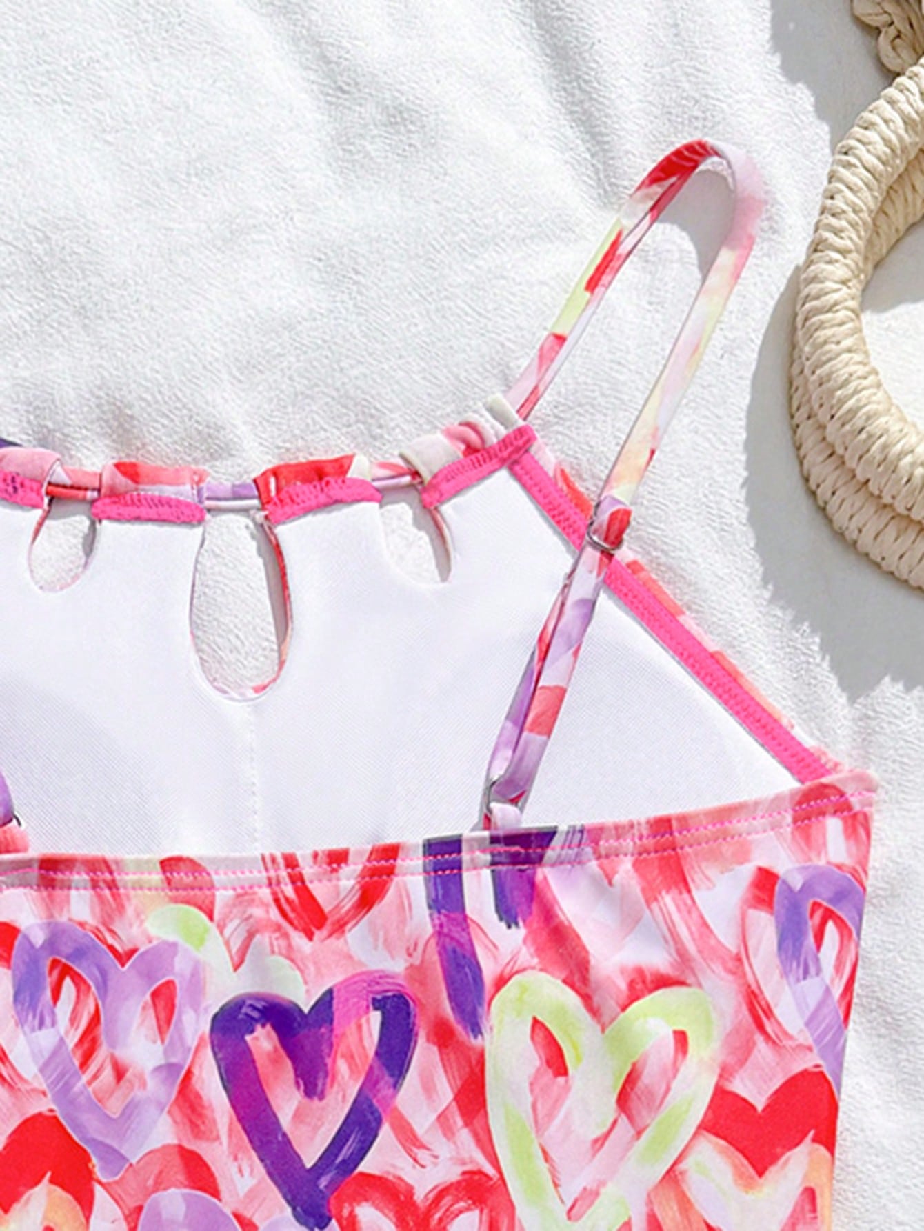 Girls black and white one-piece swimsuit set with cut-out detail, spaghetti straps, sleeveless fitted design, and matching skirt bottom for vacation swimwear.