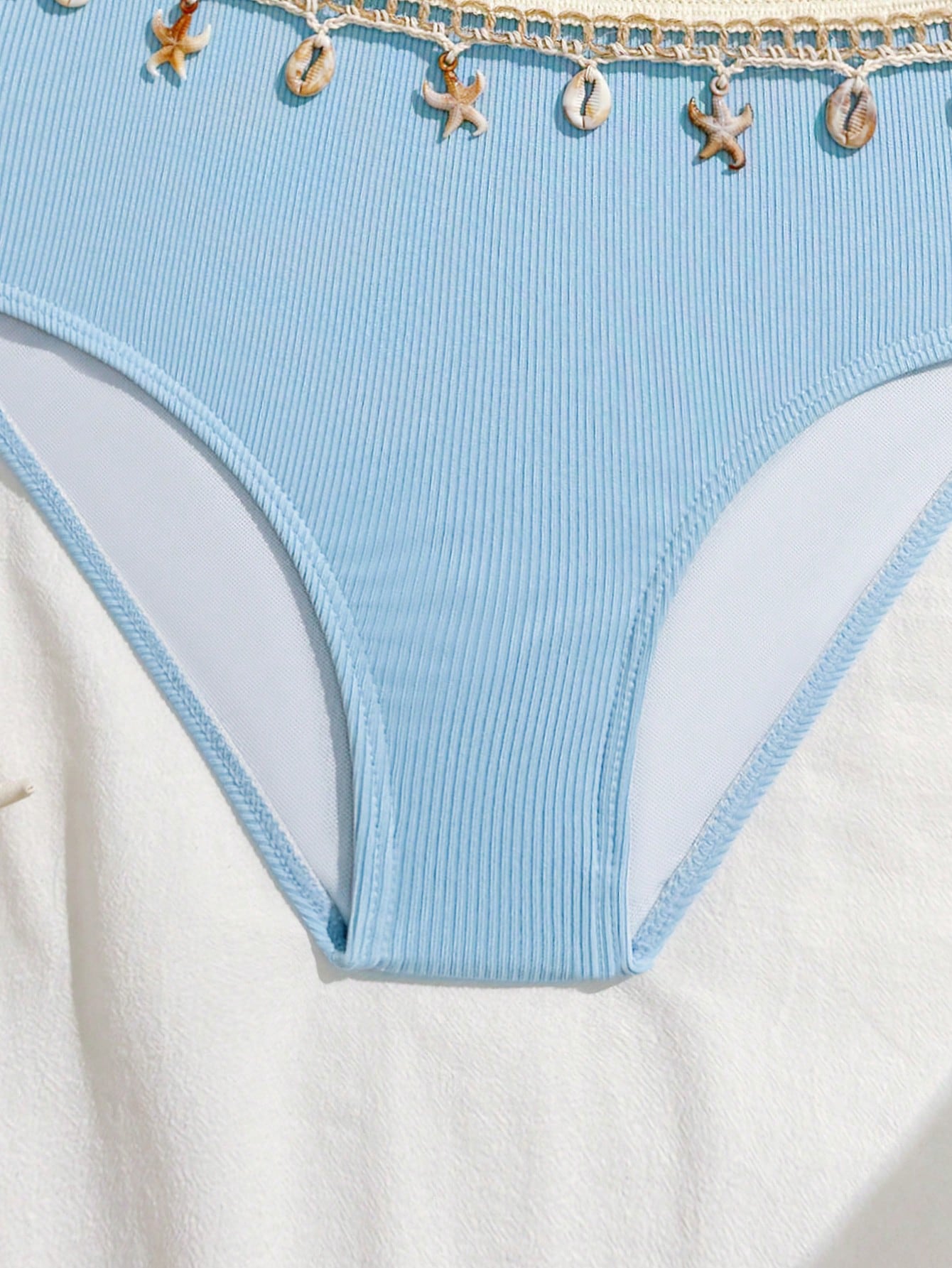 Girls black one-piece swimsuit with asymmetrical neckline, cutout waist detail, colorblock design, and medium-stretch swimsuit fabric for beach and pool wear.