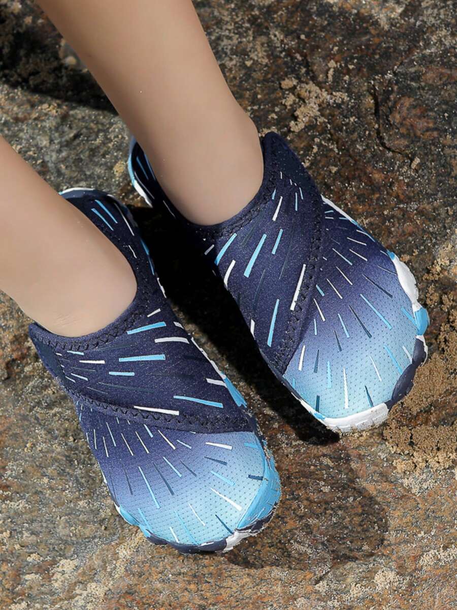 Multicolor kids water shoes with breathable mesh upper, luminous accents, and durable rubber sole with hook and loop closure.
