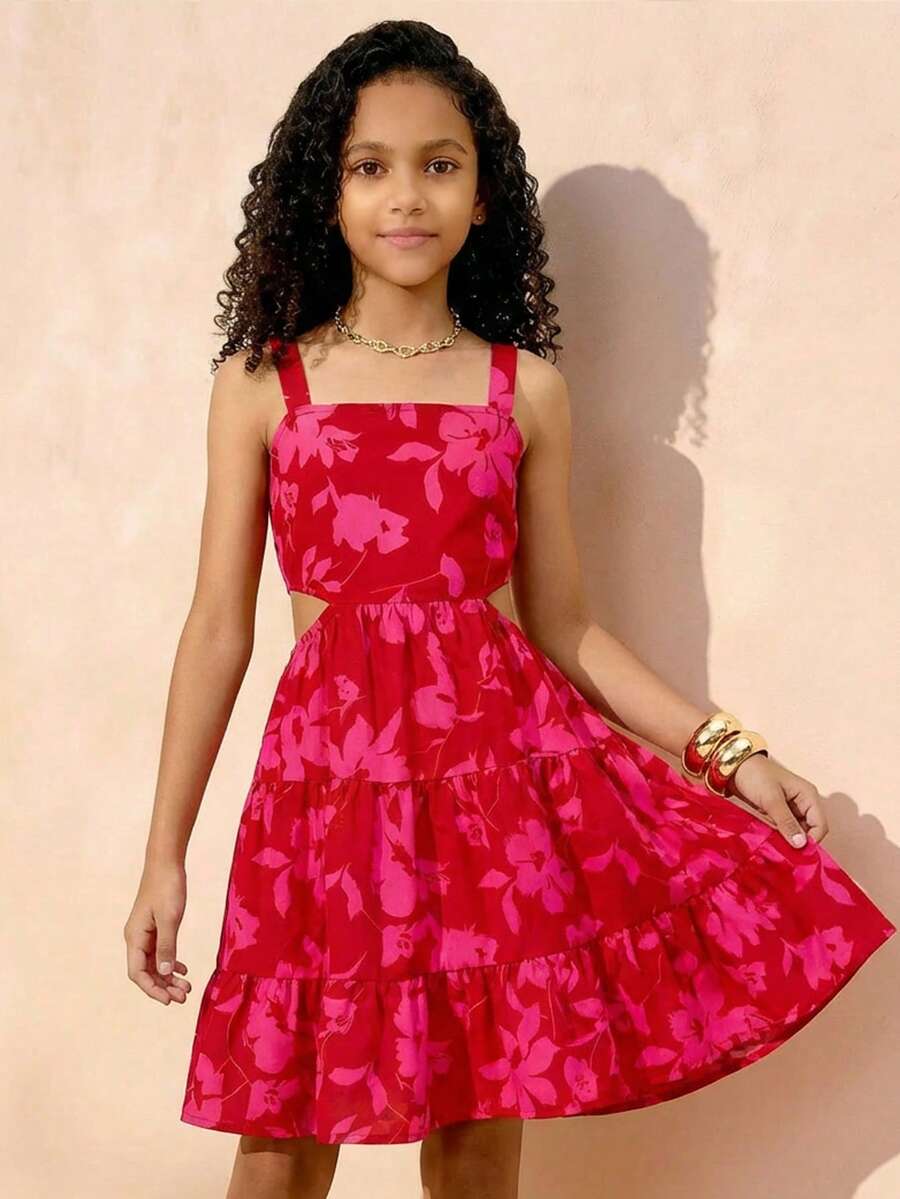 Red floral print halter dress for tween girls with cutout waist, bow front, shirred details, belted high waist, sleeveless cami shape, and layered tiered hem.