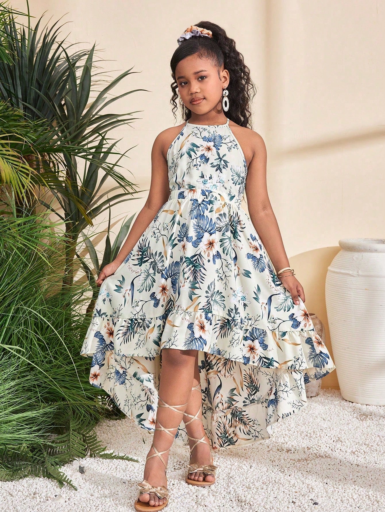 Apricot tween girls sleeveless halter dress with floral plant print, cut-out detail, high waist, and long flared hem for vacation or holiday outfits