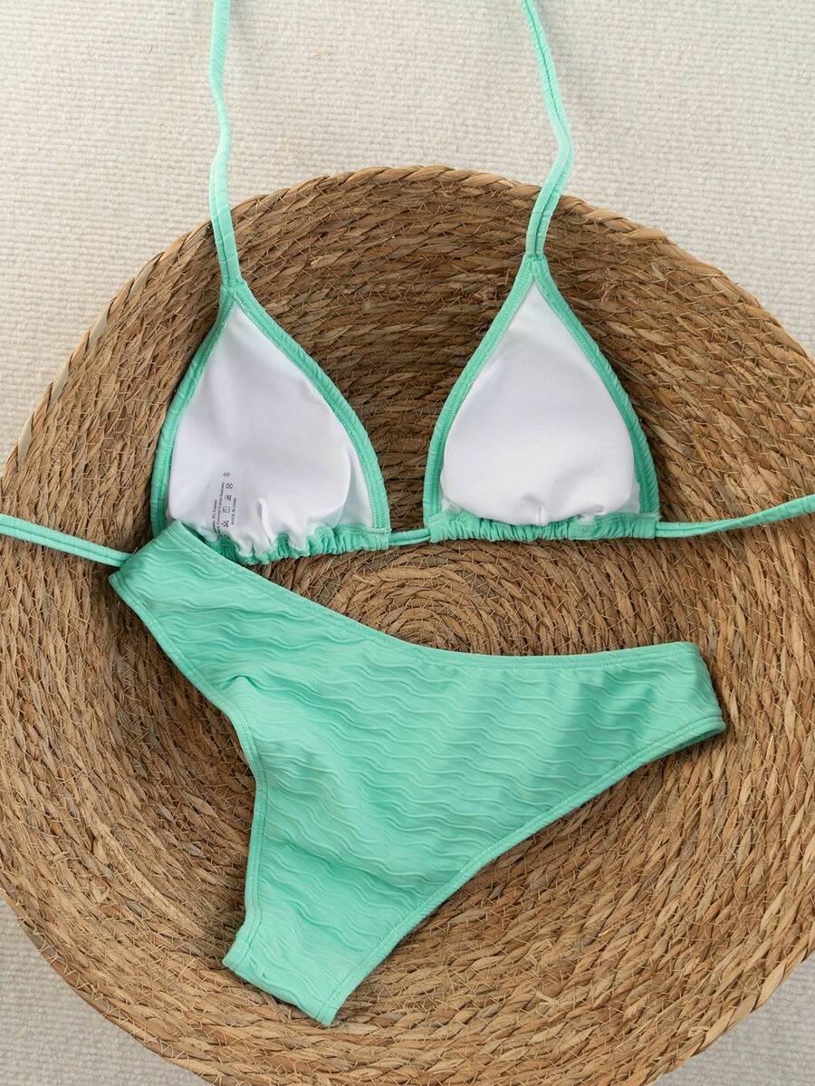 Women's apricot 2-piece halter bikini set featuring a wireless triangle top with tie-back detail and high-waisted high-cut bottoms.