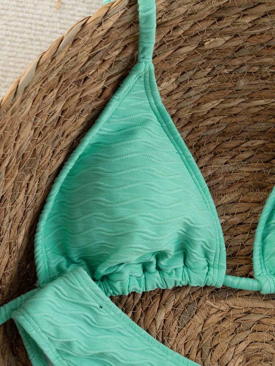 Women's apricot 2-piece halter bikini set featuring a wireless triangle top with tie-back detail and high-waisted high-cut bottoms.