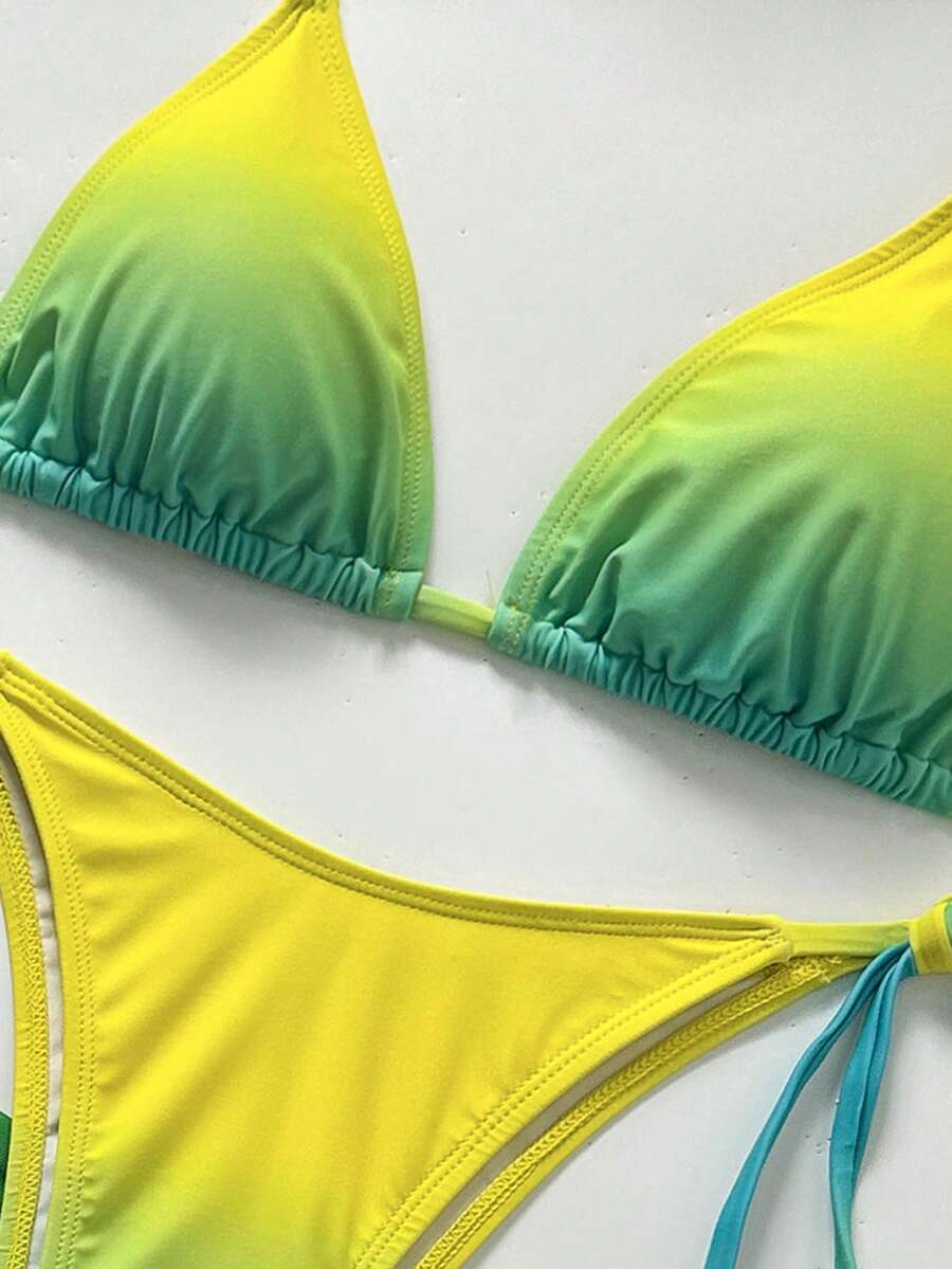 Women's 3-piece gradient bikini set featuring a green halter tie top with removable padding, low waist bottoms, and a matching sheer mesh skirt.