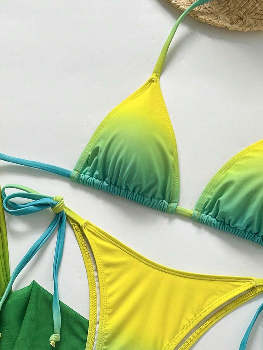 Women's 3-piece gradient bikini set featuring a green halter tie top with removable padding, low waist bottoms, and a matching sheer mesh skirt.