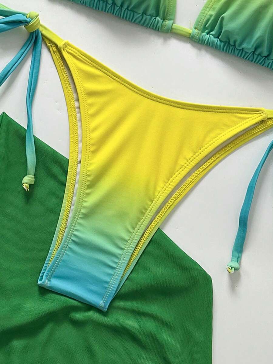 Women's 3-piece gradient bikini set featuring a green halter tie top with removable padding, low waist bottoms, and a matching sheer mesh skirt.