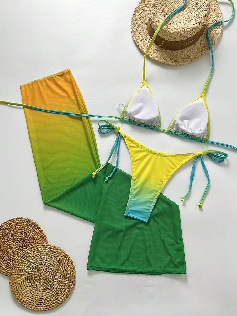Women's 3-piece gradient bikini set featuring a green halter tie top with removable padding, low waist bottoms, and a matching sheer mesh skirt.