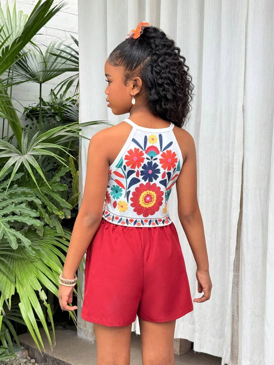 Girls 2-piece vacation outfit set with sleeveless halter knit crop top and graphic cargo shorts.