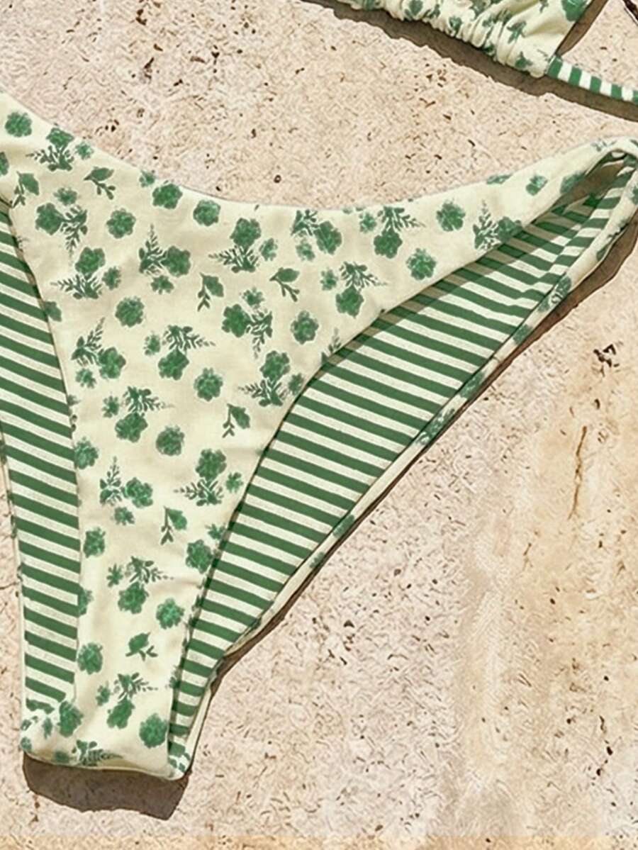 Women's two-piece halter bikini set featuring high cut thong bottoms and removable padding