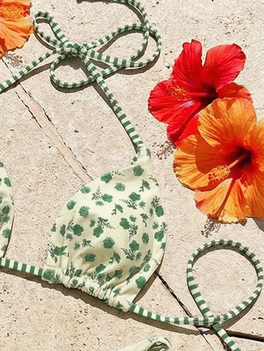 Women's two-piece halter bikini set featuring high cut thong bottoms and removable padding