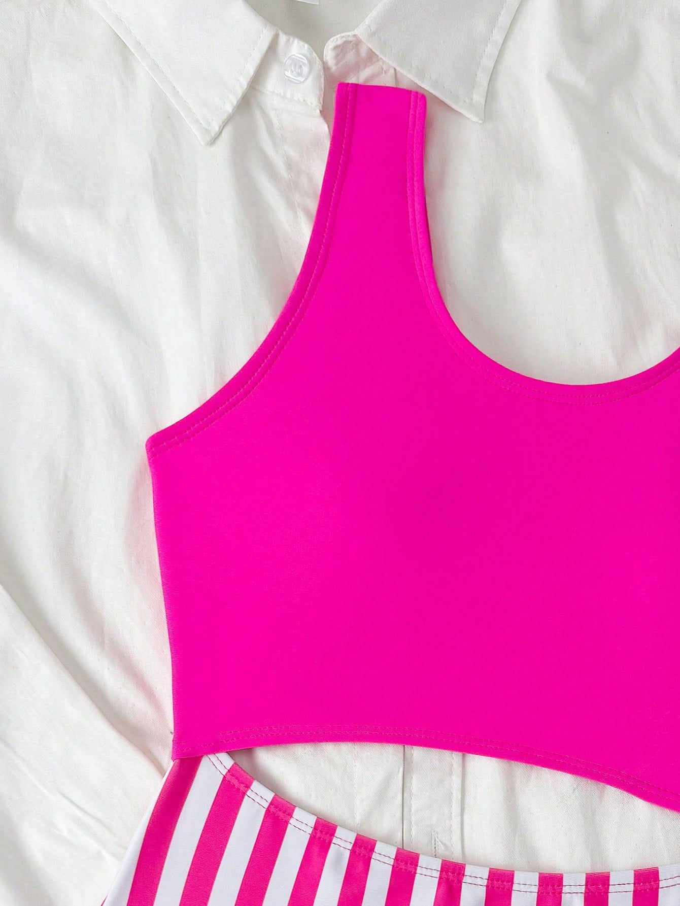 Purple tween girls one-piece swimsuit with asymmetrical neckline, cut-out waist, striped pattern, fitted silhouette, and lined body.