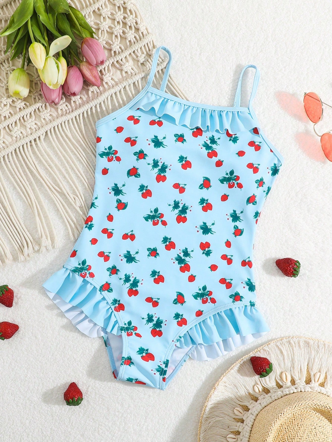 Tween girl plaid all-over print one-piece swimsuit with ruffle detail, spaghetti straps, fitted shape, and multicolor patchwork style for beach or pool wear.