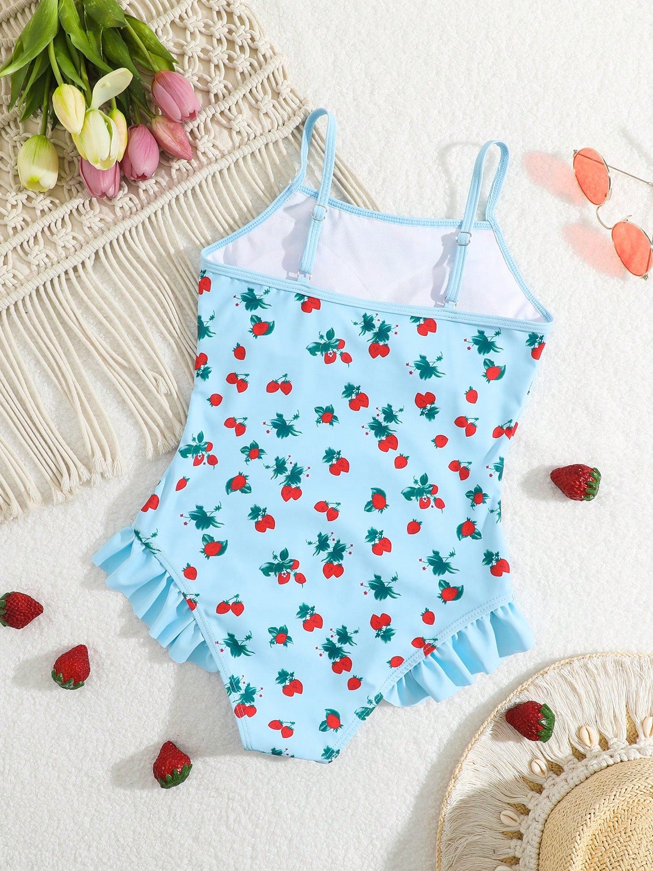Tween girl plaid all-over print one-piece swimsuit with ruffle detail, spaghetti straps, fitted shape, and multicolor patchwork style for beach or pool wear.