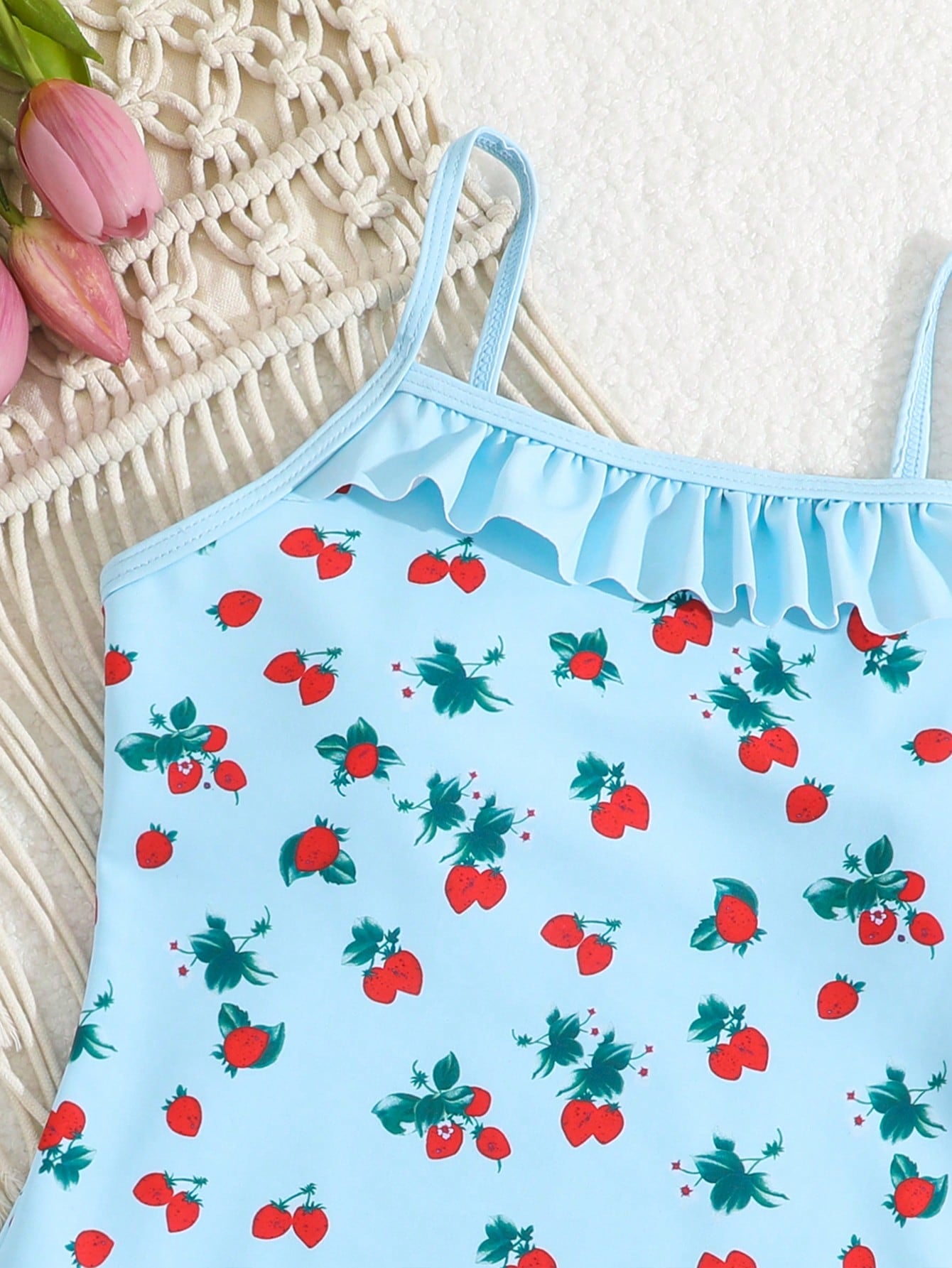 Tween girl plaid all-over print one-piece swimsuit with ruffle detail, spaghetti straps, fitted shape, and multicolor patchwork style for beach or pool wear.