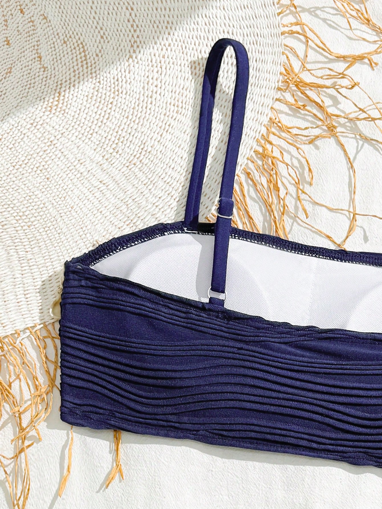 Tween girls bikini set with shell and starfish woven band details, spaghetti strap sleeveless top, and mid-waist skirt-style bottom in blue.