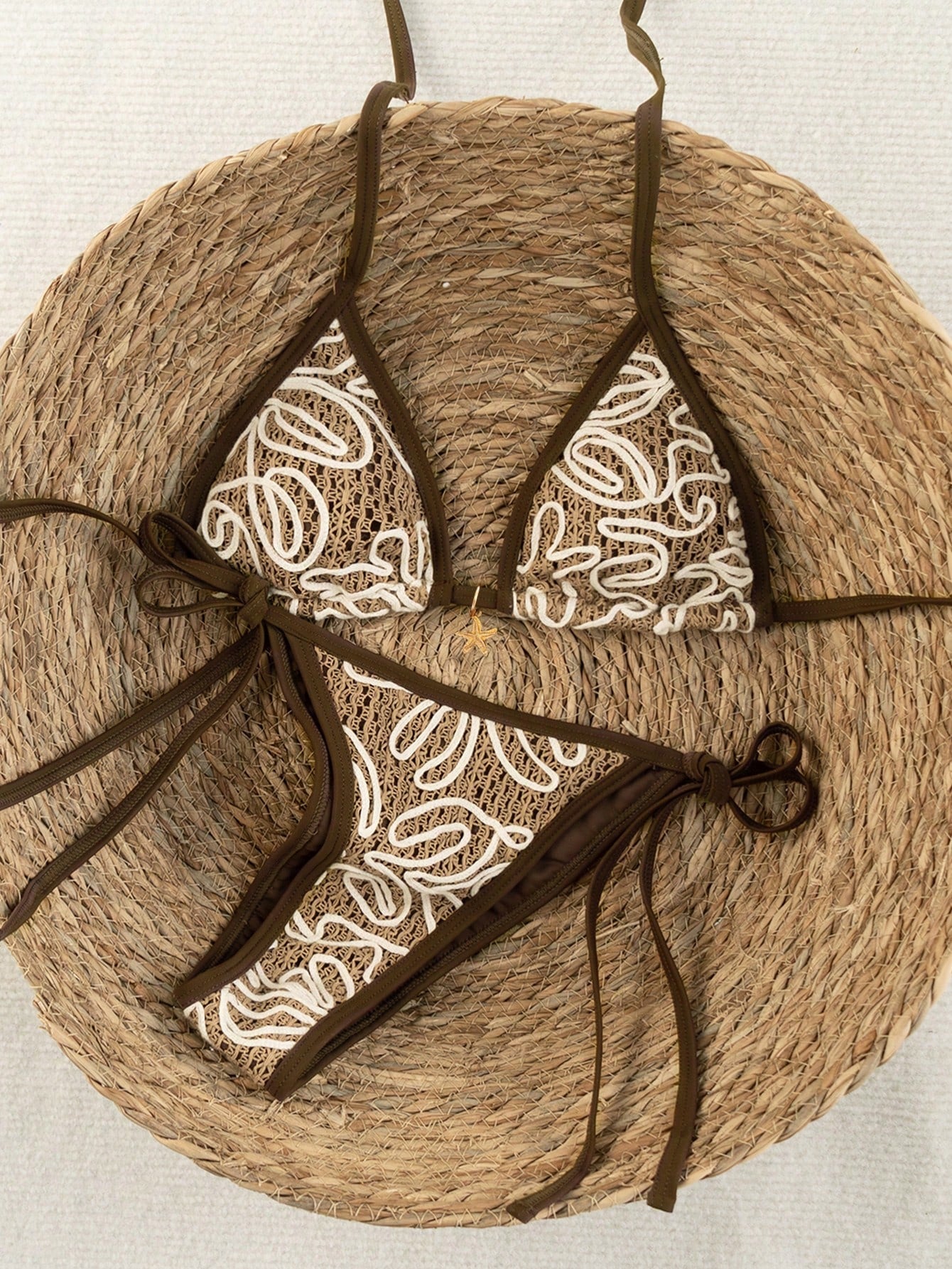Apricot 2-piece bikini swimwear set featuring a textured halter triangle cup top with knot details and matching tie-side bottoms for women.
