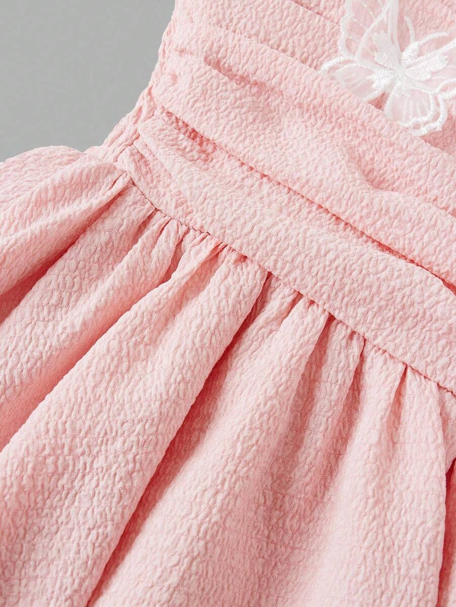 Tween girls apricot tiered cami dress with spaghetti straps, high waist, and slim fit layered hem.