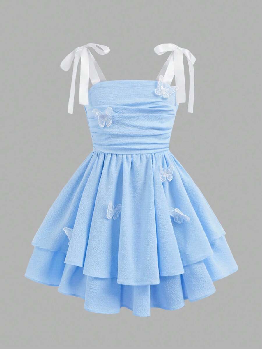 Tween girls apricot tiered cami dress with spaghetti straps, high waist, and slim fit layered hem.