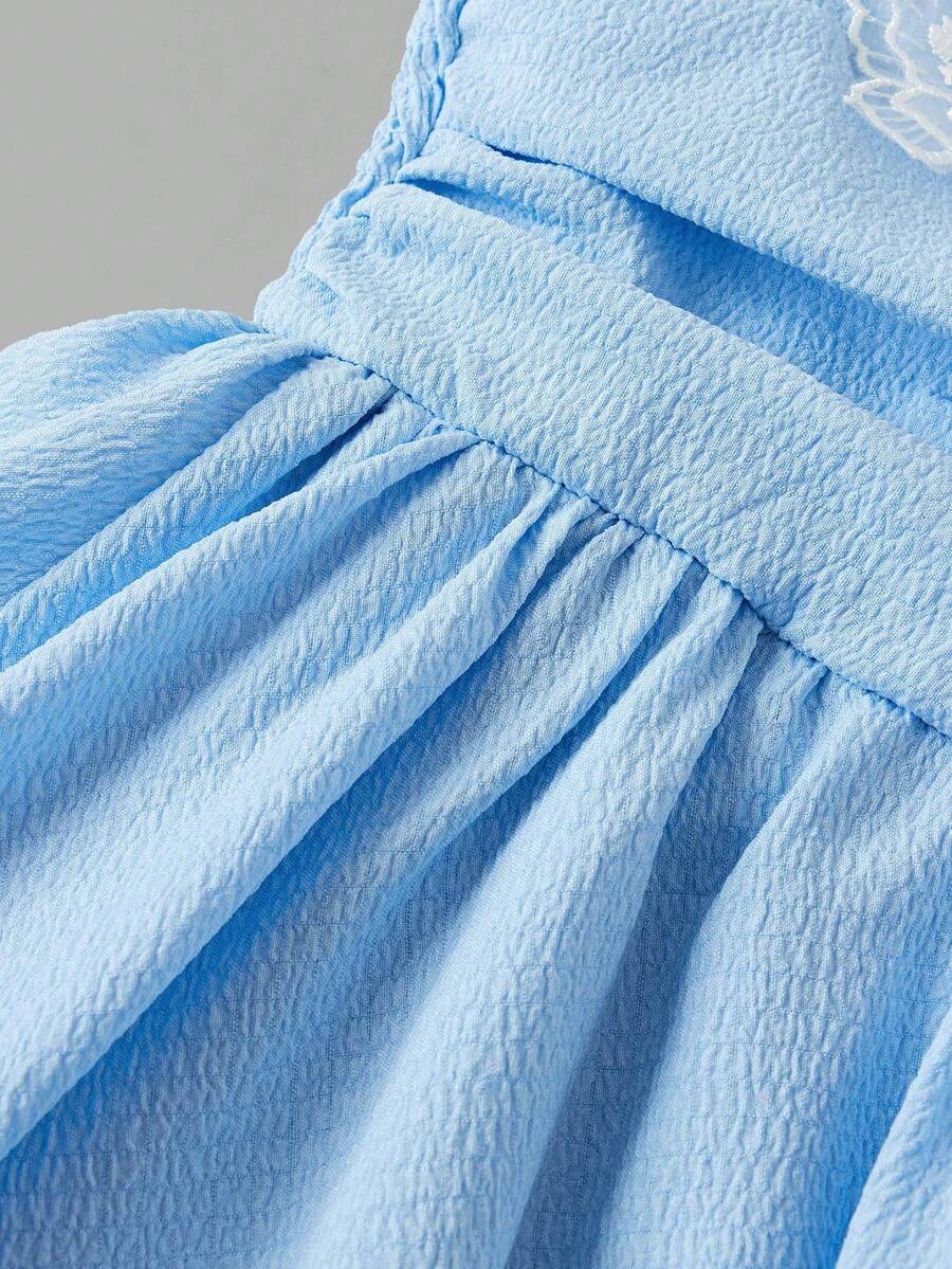 Tween girls apricot tiered cami dress with spaghetti straps, high waist, and slim fit layered hem.