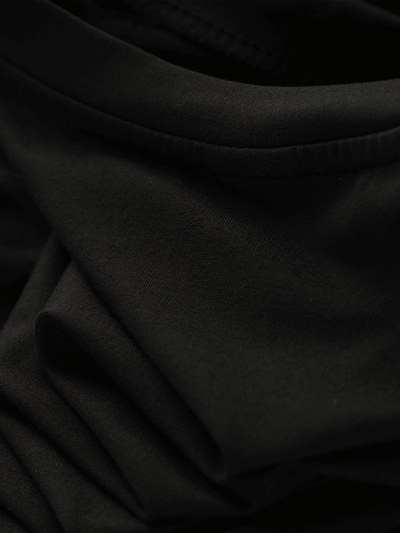Girls black ruffle sleeve midi dress featuring a loose fit tunic silhouette, round neckline, button details, and short flounce sleeves.