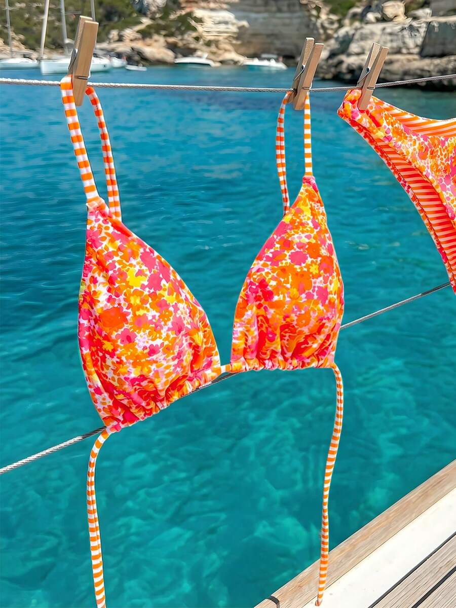 Women's two-piece halter bikini set featuring high cut thong bottoms and removable padding
