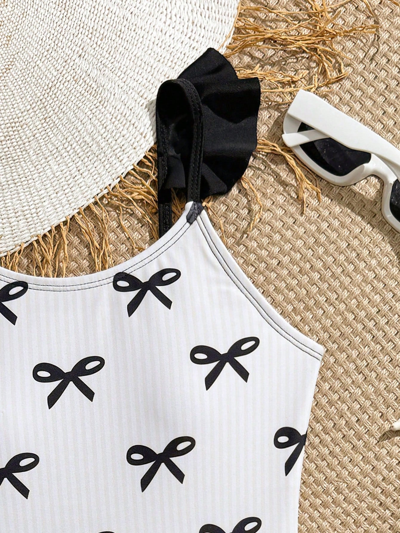 Tween girls one-piece swimsuit in leopard print with ruffle shoulder straps, scoop neckline, fitted shape, and attached ruffle hem skirt; sleeveless, mid-waist skirt bottom, and lined body for swimming, vacation, and summer beach wear.