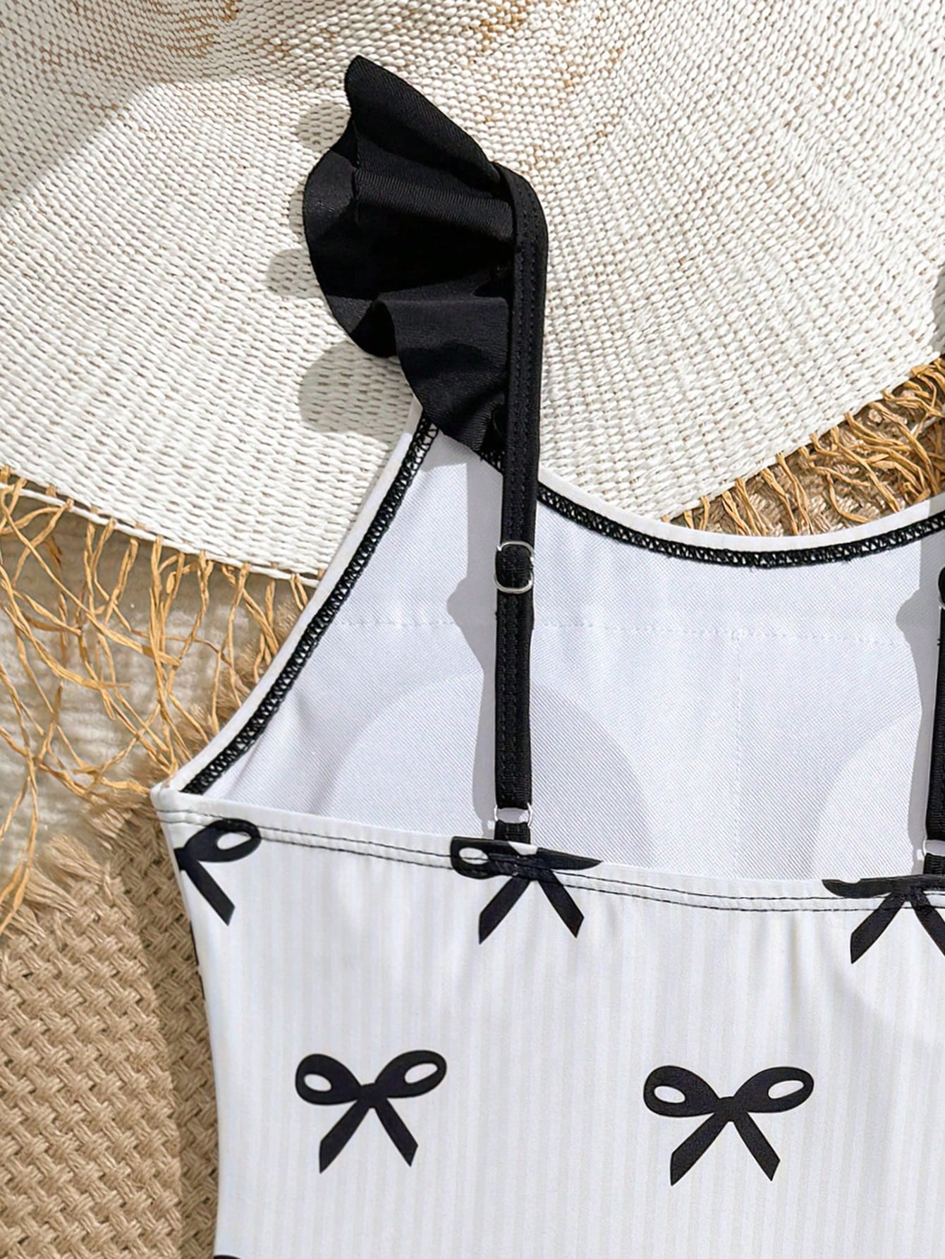 Tween girls one-piece swimsuit in leopard print with ruffle shoulder straps, scoop neckline, fitted shape, and attached ruffle hem skirt; sleeveless, mid-waist skirt bottom, and lined body for swimming, vacation, and summer beach wear.