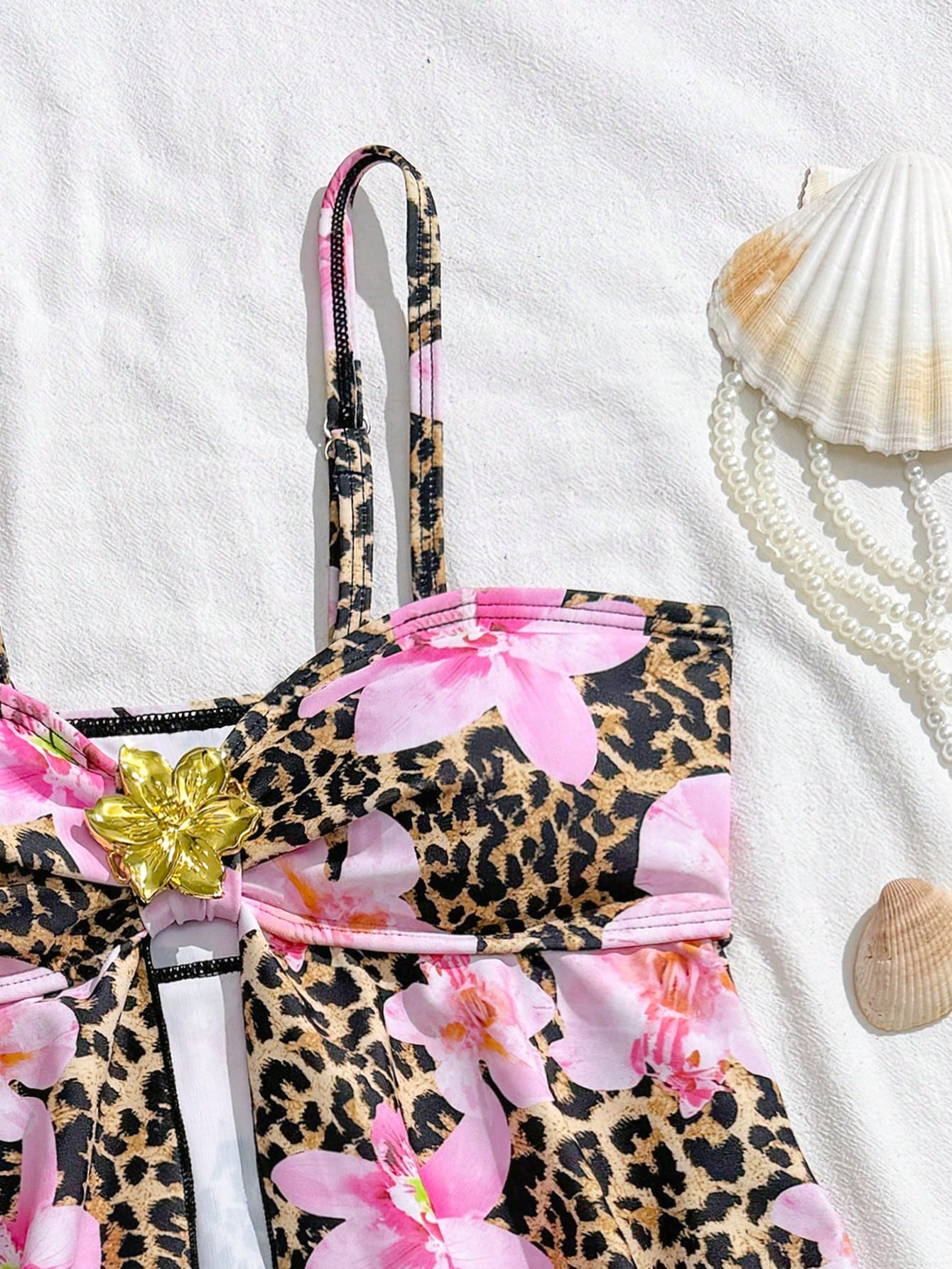 Tween girls 2-piece tankini swimwear set in apricot with a textured jacquard look, asymmetrical spaghetti-strap sleeveless top, and matching mid-waist short bikini bottoms.