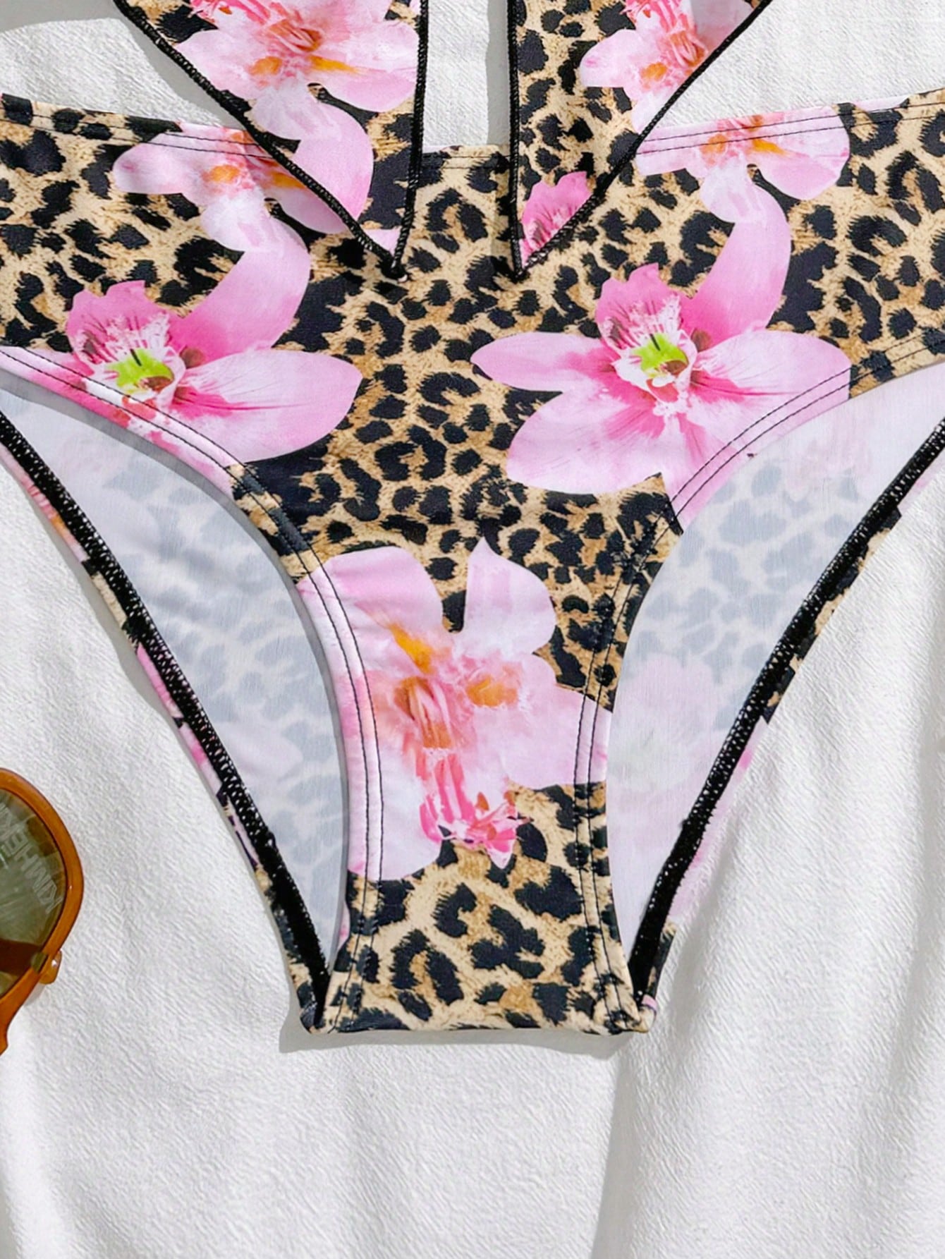 Tween girls 2-piece tankini swimwear set in apricot with a textured jacquard look, asymmetrical spaghetti-strap sleeveless top, and matching mid-waist short bikini bottoms.