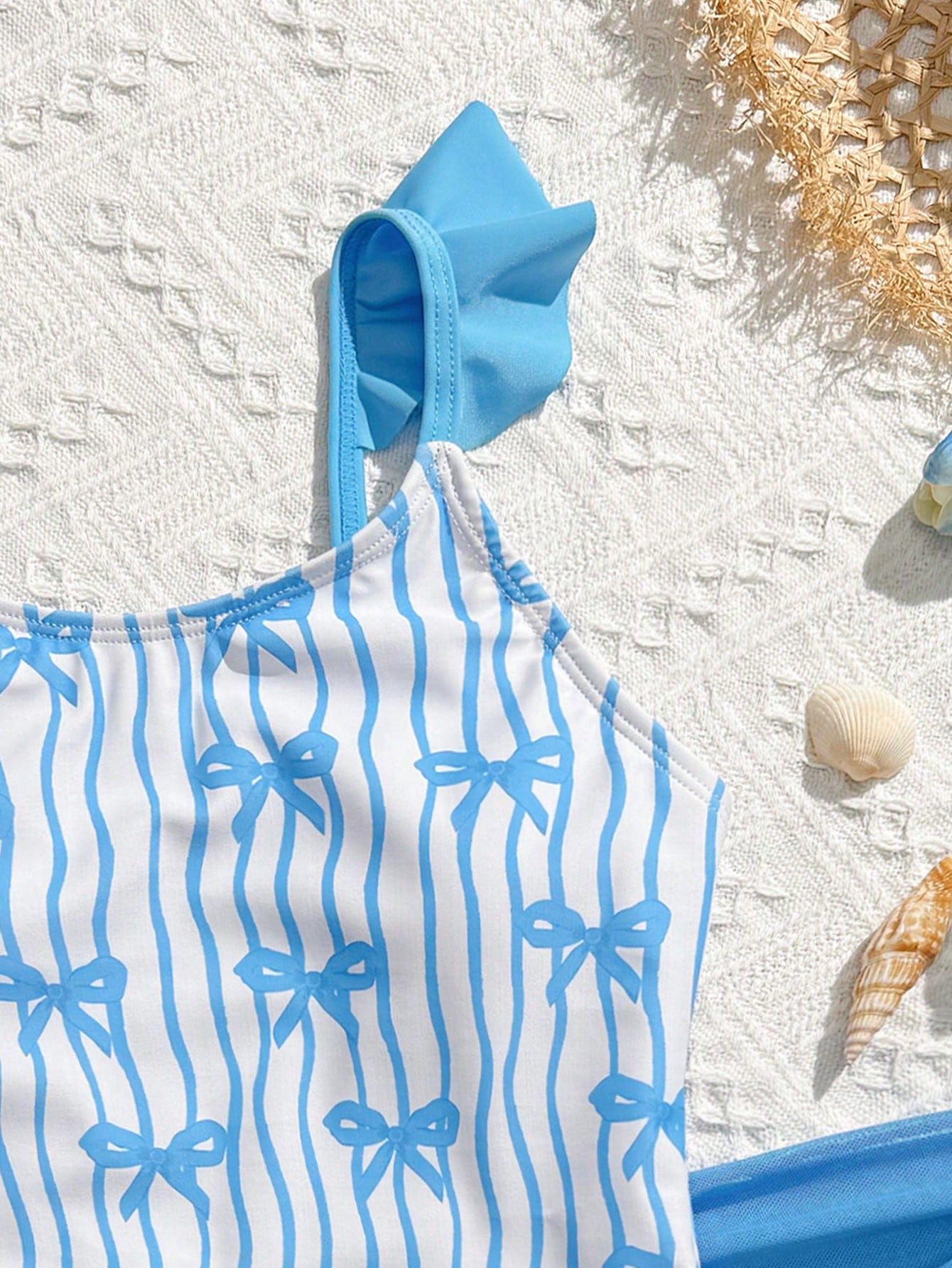 Tween girls one-piece swimsuit in leopard print with ruffle shoulder straps, scoop neckline, fitted shape, and attached ruffle hem skirt; sleeveless, mid-waist skirt bottom, and lined body for swimming, vacation, and summer beach wear.