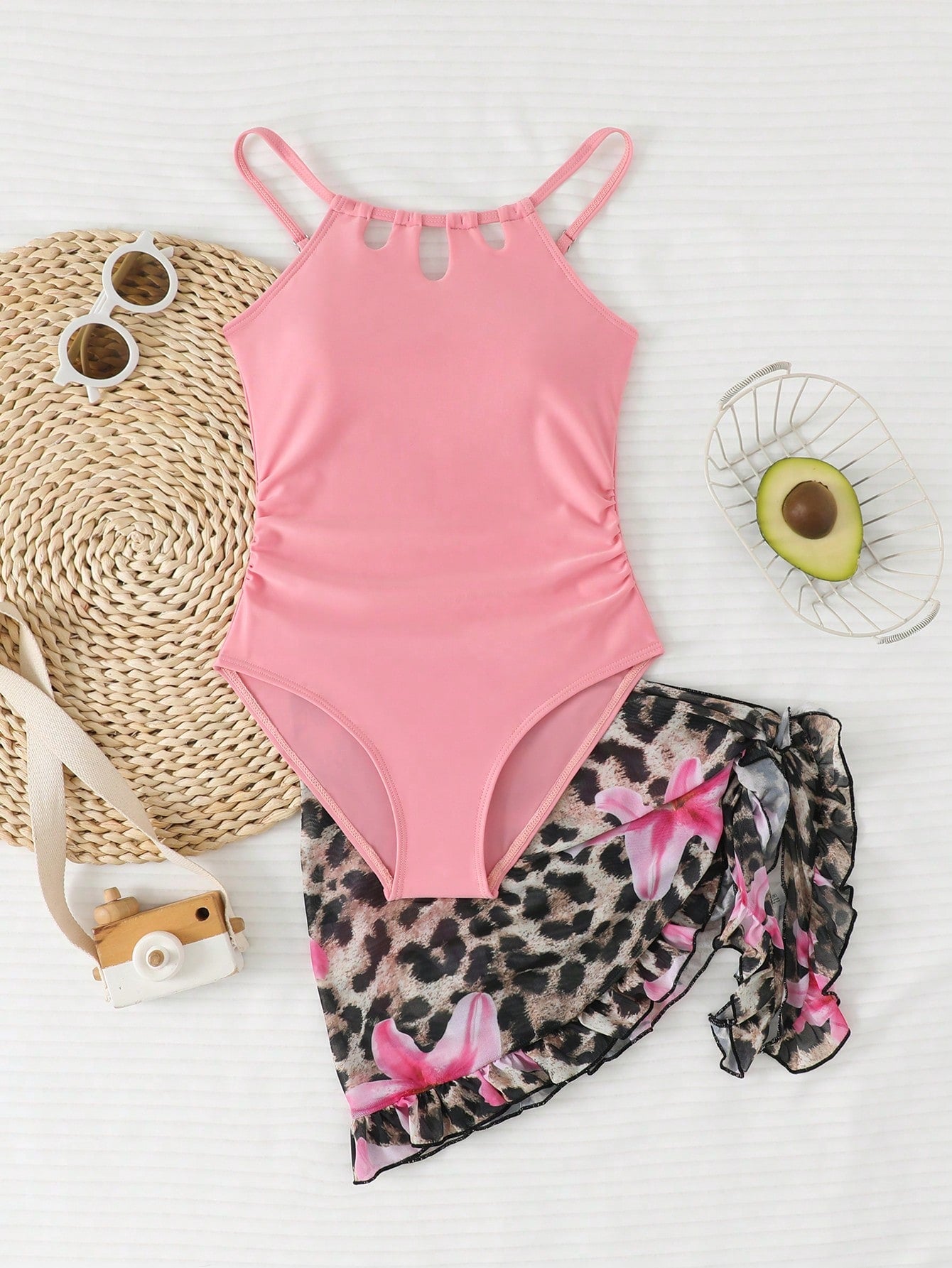 Girls black and white one-piece swimsuit set with cut-out detail, spaghetti straps, sleeveless fitted design, and matching skirt bottom for vacation swimwear.